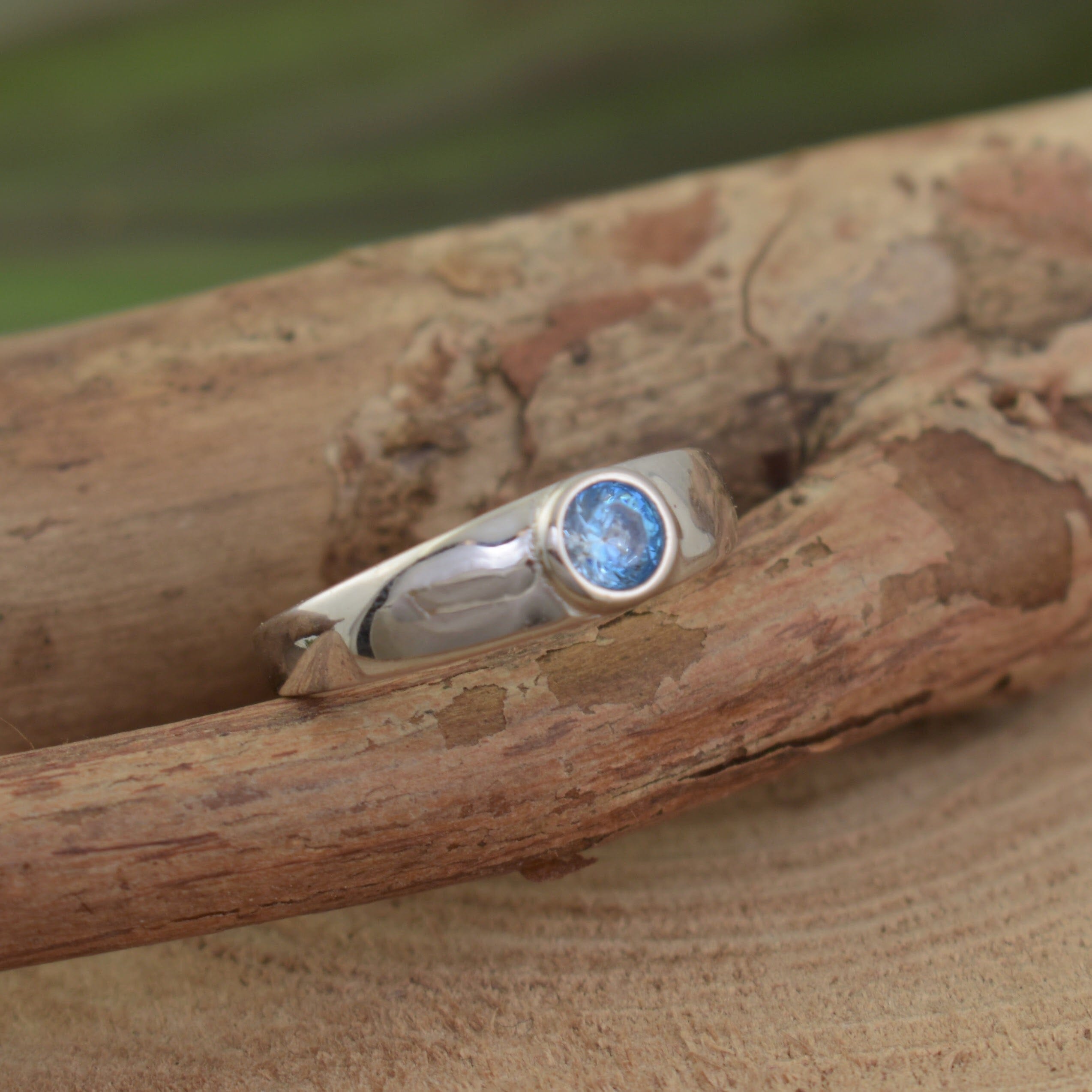Aquamarine blue bezel set stone