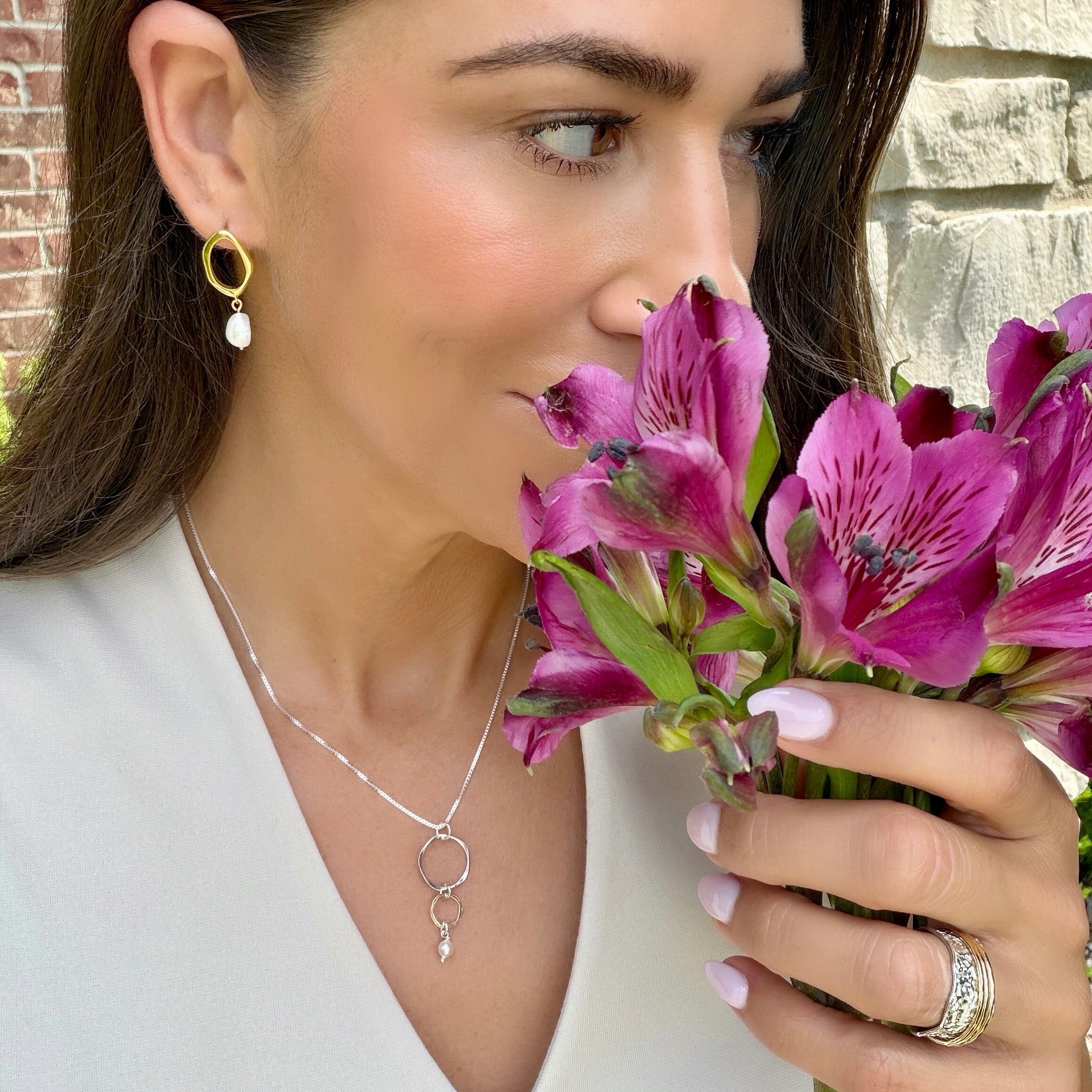 gold brass earrings with a dangling pearl