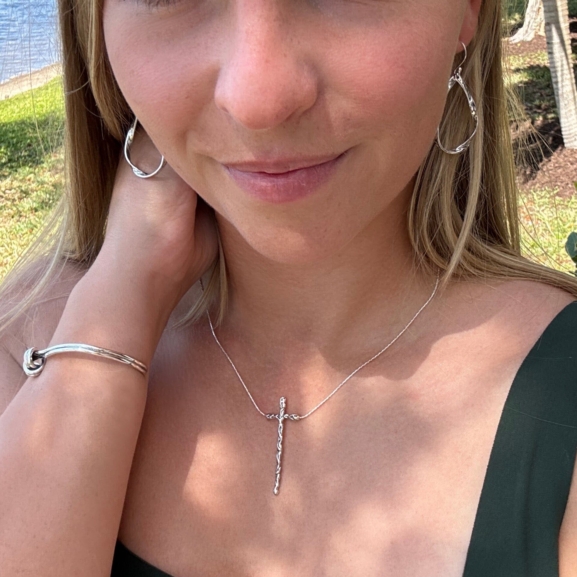 rugged style silver cross on a delicate silver chain