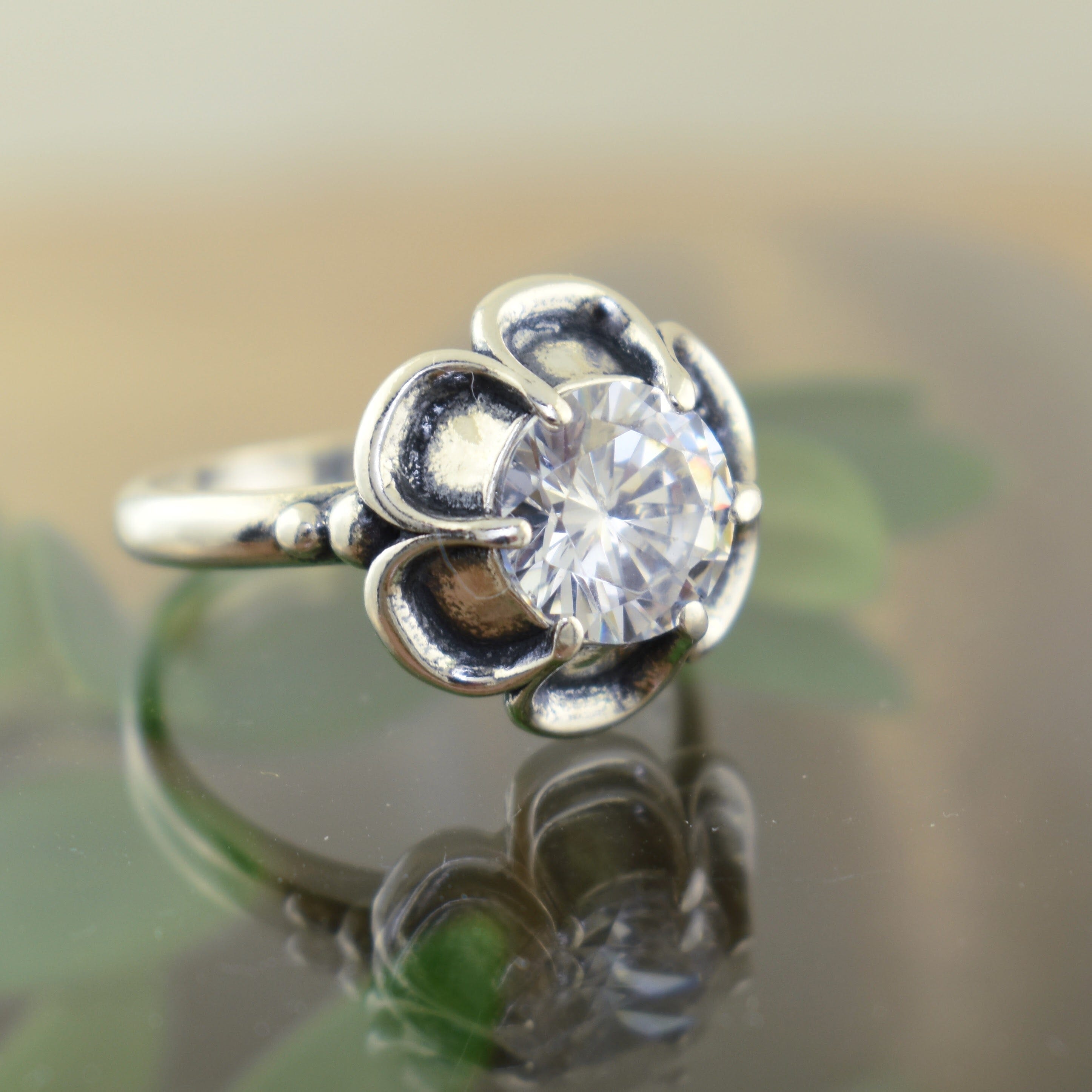 .925 sterling silver flower ring with clear cubic zirconia center stone