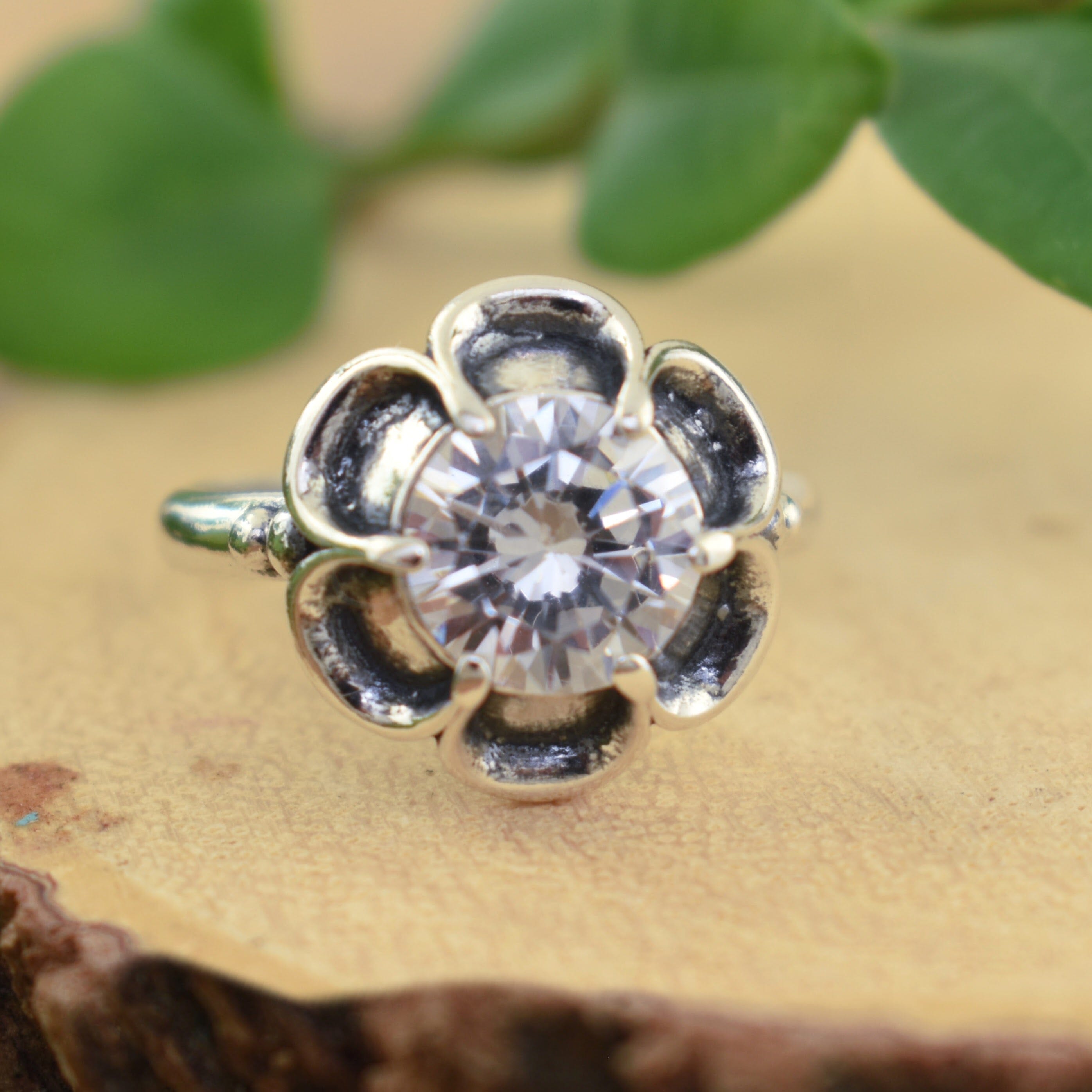 CZ stone ring set in sterling silver flower design