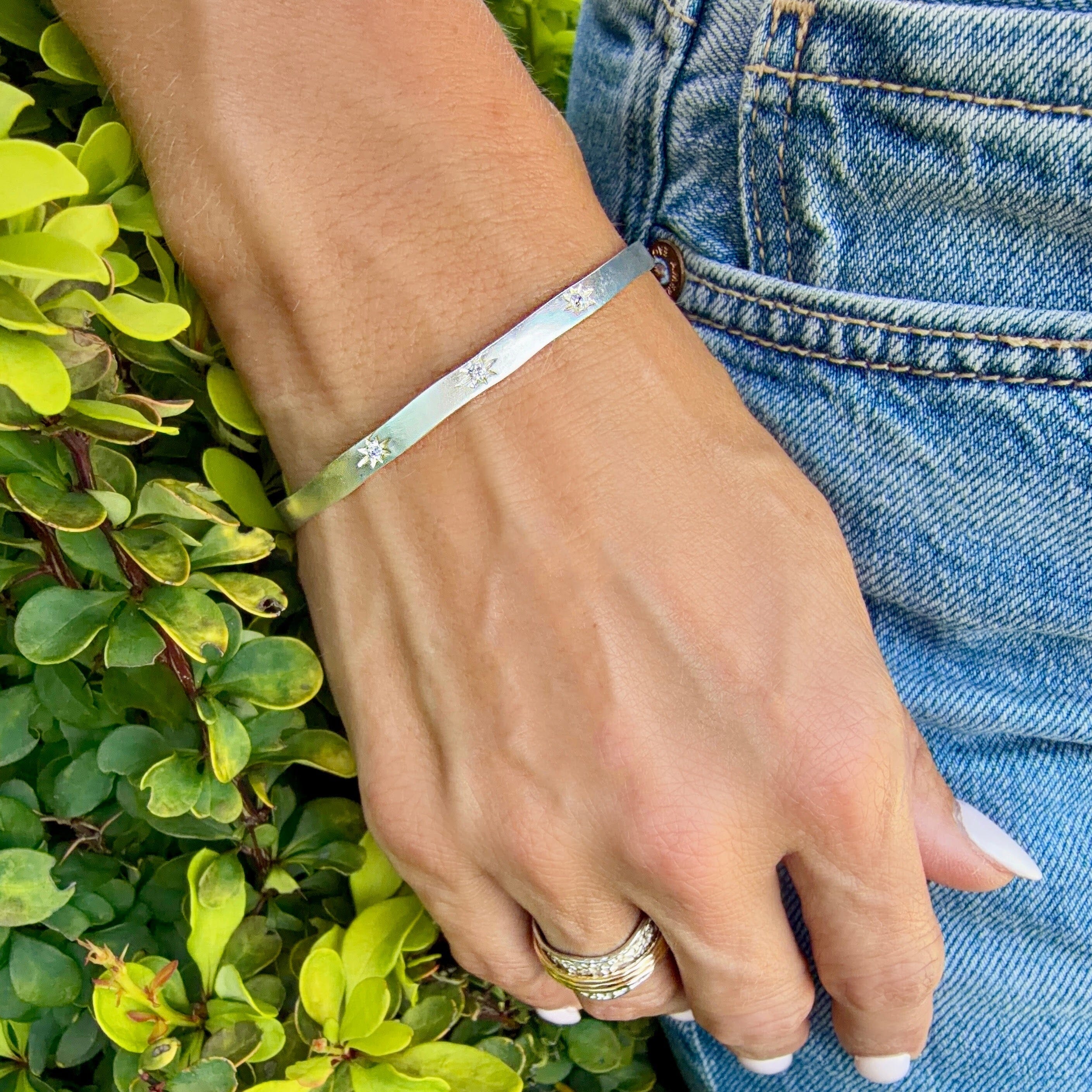 silver plated cuff bracelet with starburst cz details