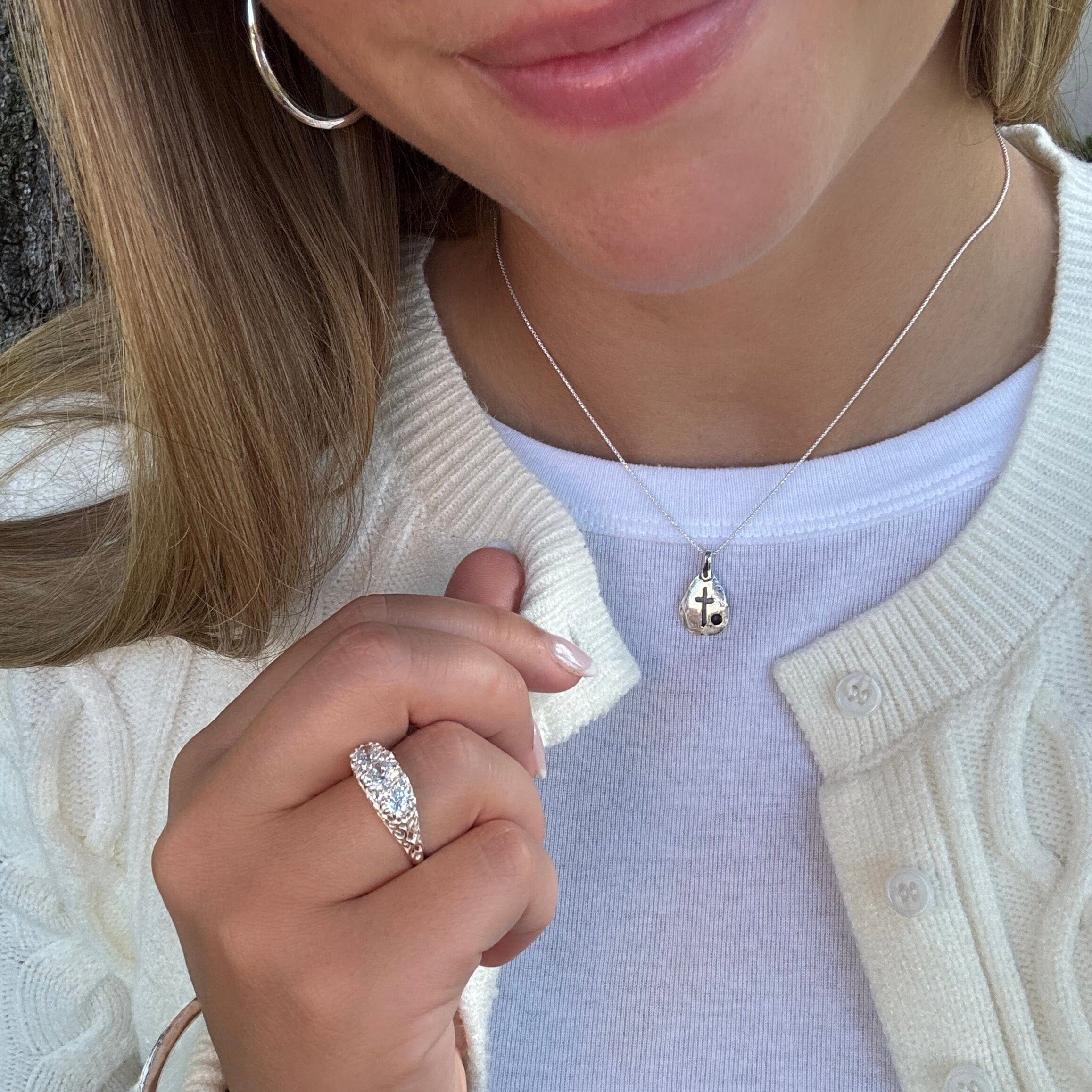 dainty christian-style necklace with a cutout cross
