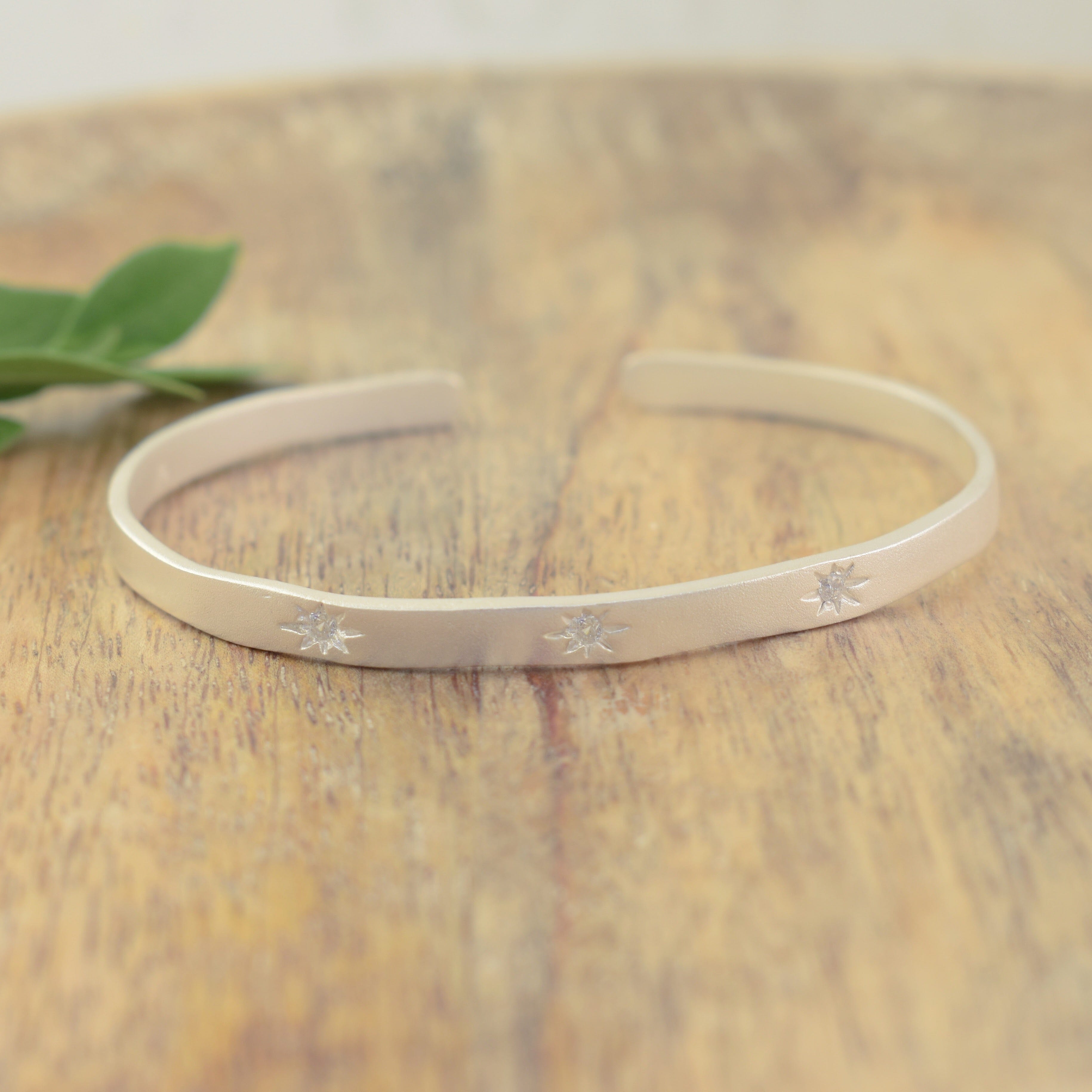 simple brass cuff with star details and Cz stones