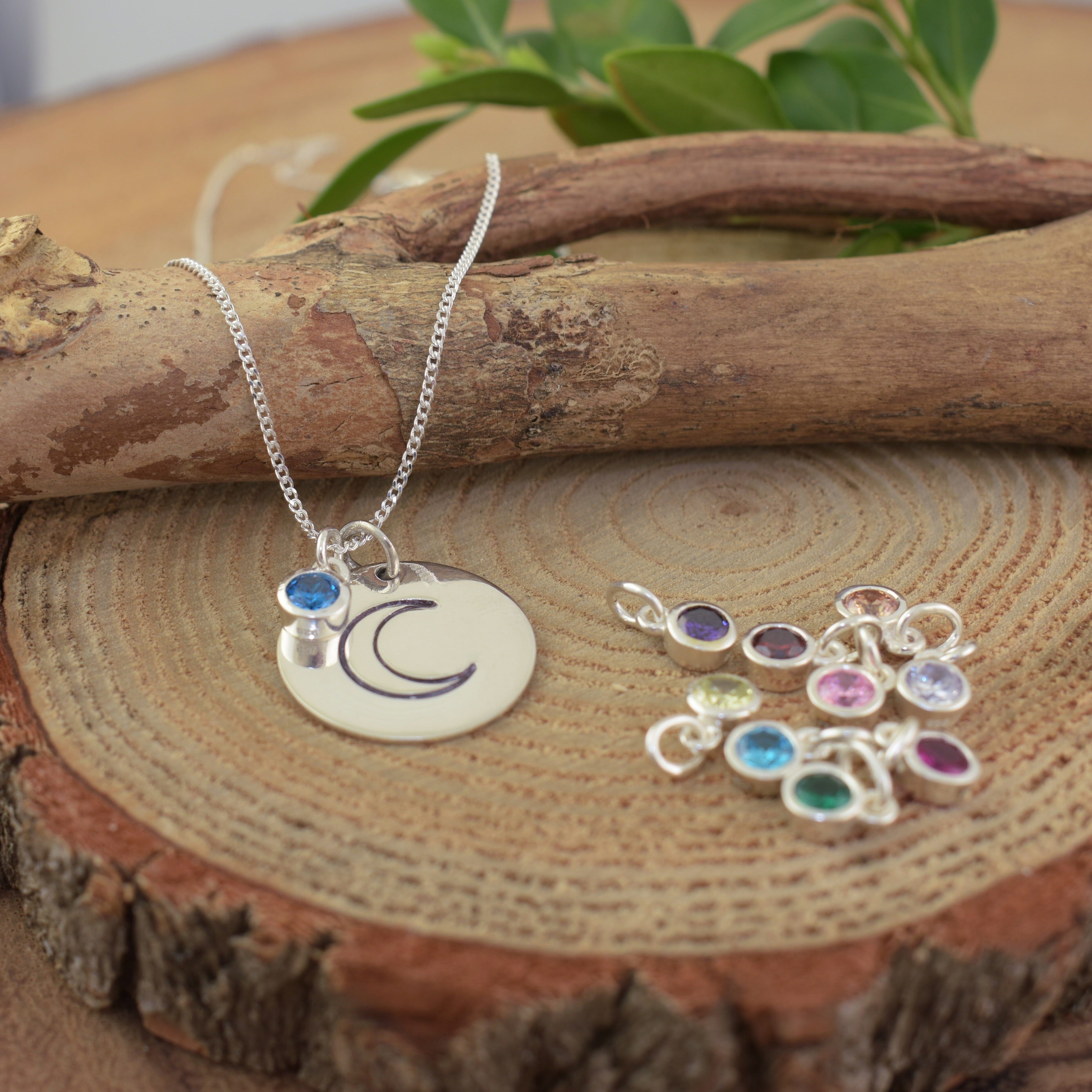 High polished sterling silver rounded pendant featuring half moon style stamp
