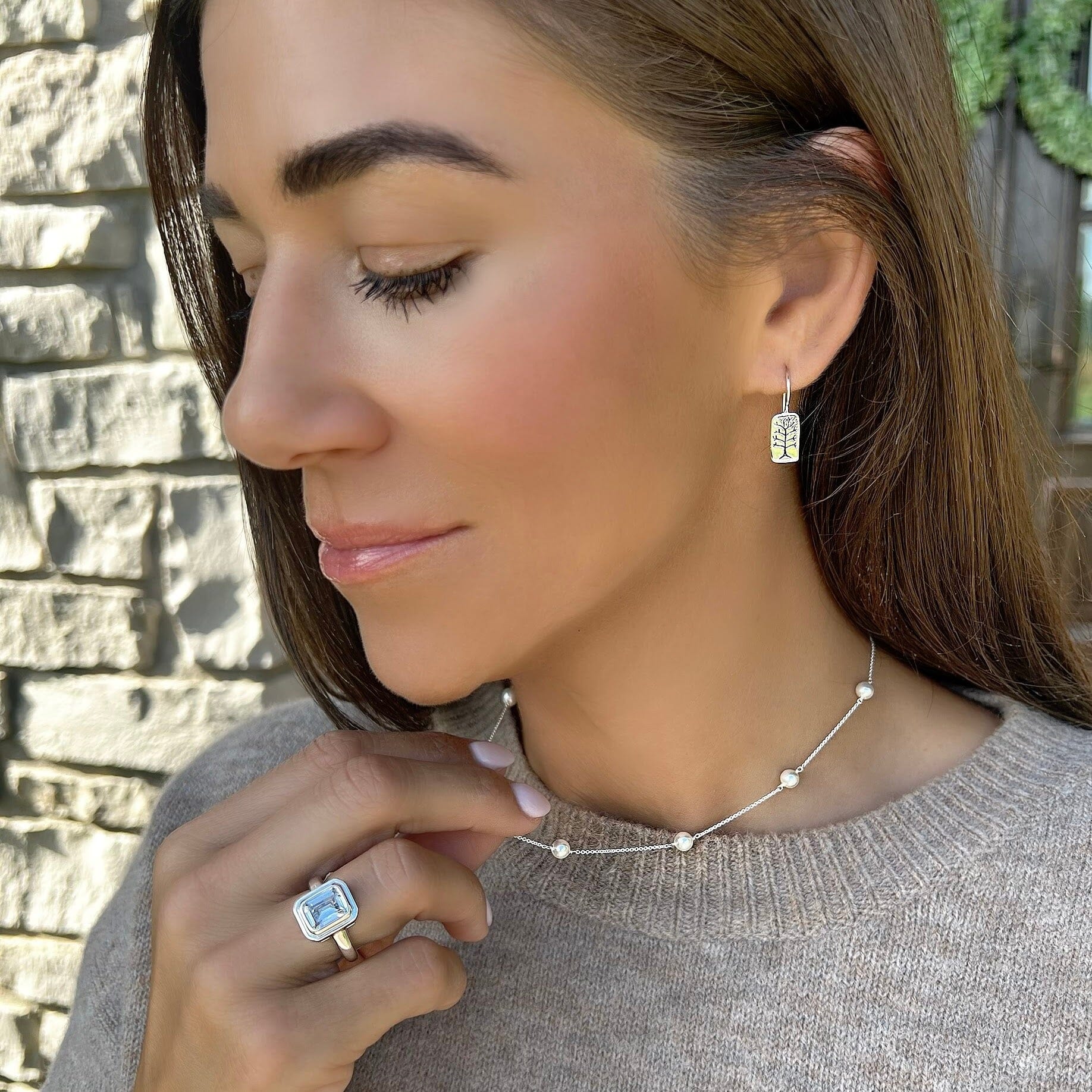 Sterling silver earrings with tree design paired with the skipping stone necklace and the tiffany ring