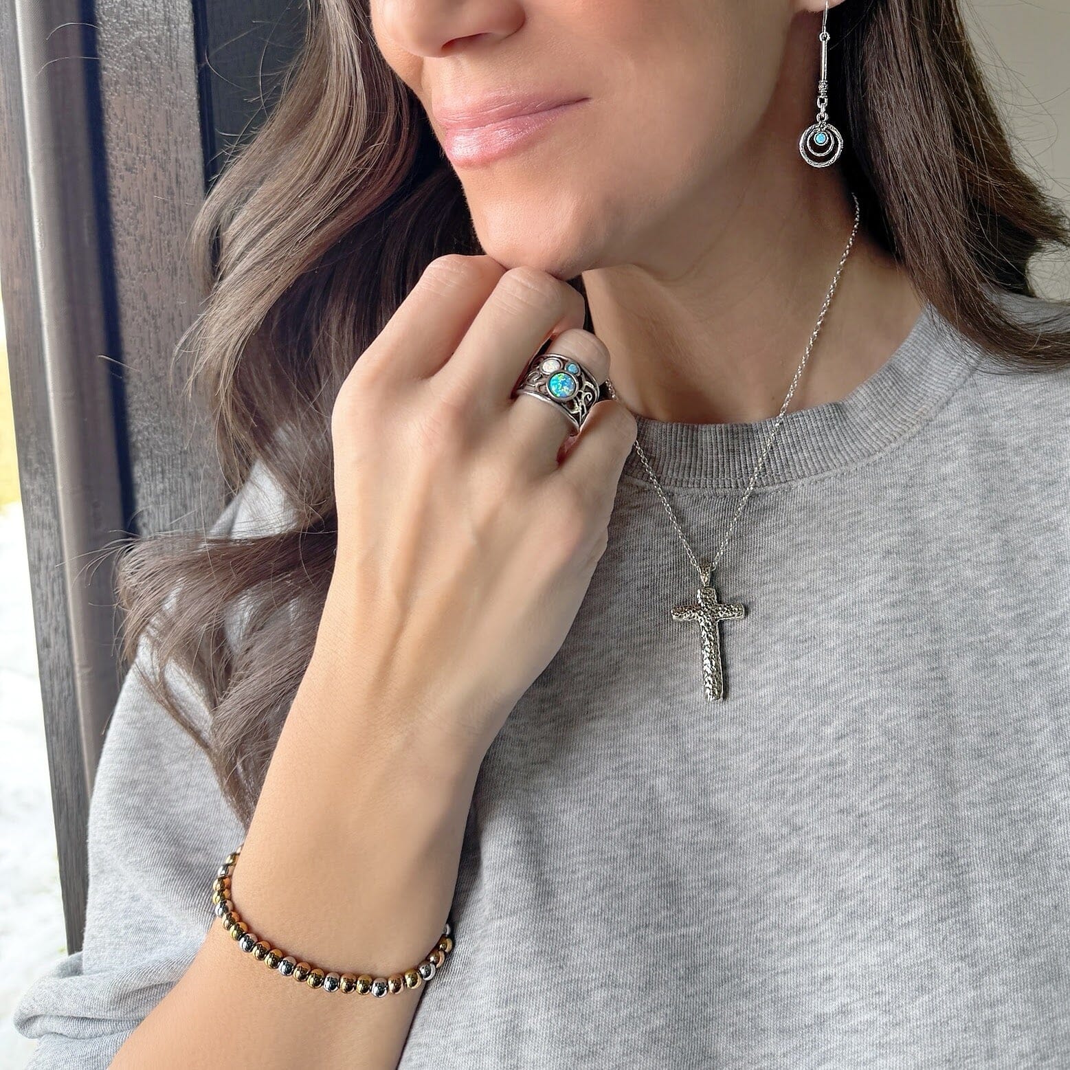 Trinity Glow Bracelet paired with sterling silver jewelry