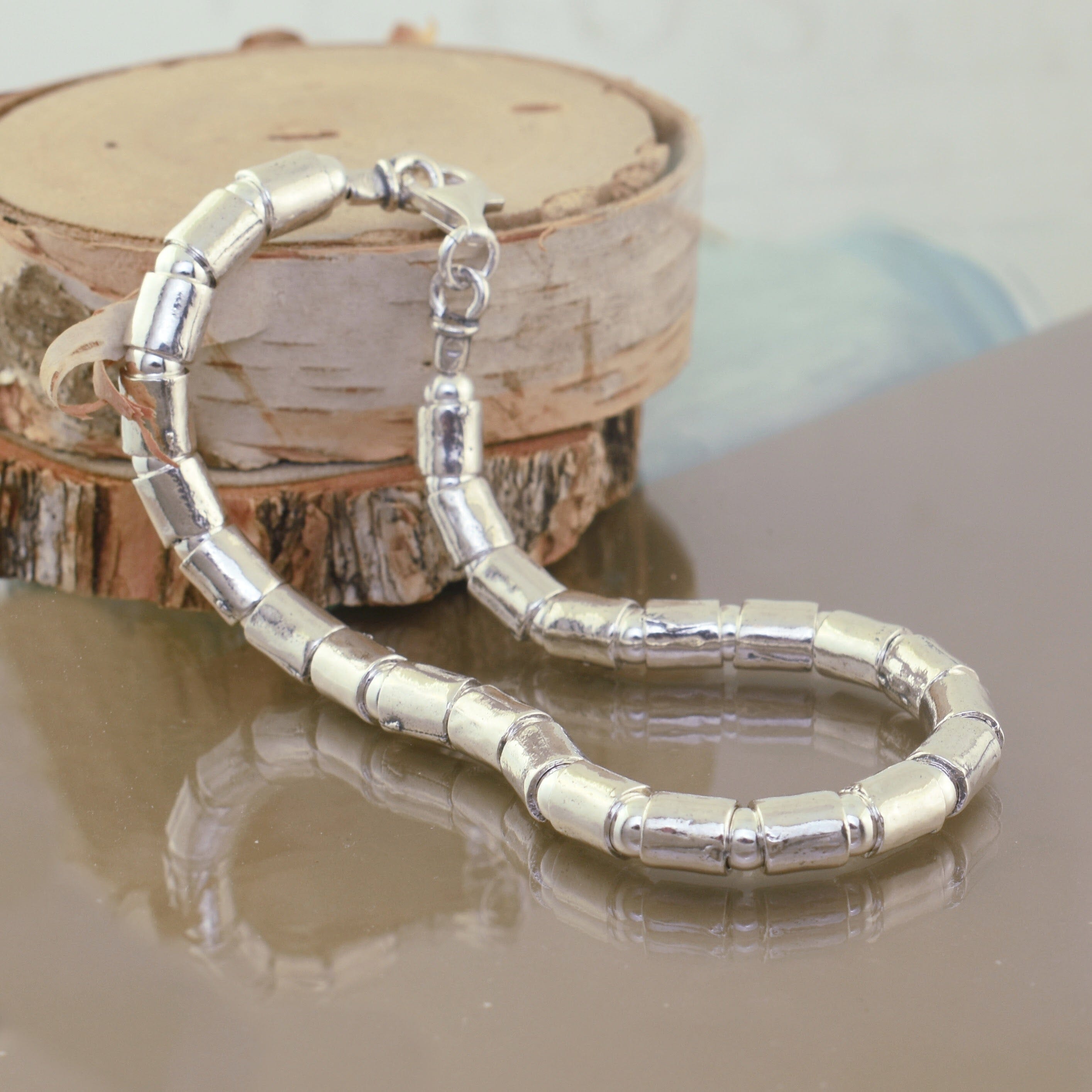 minimalist style silver bracelet with oval beads