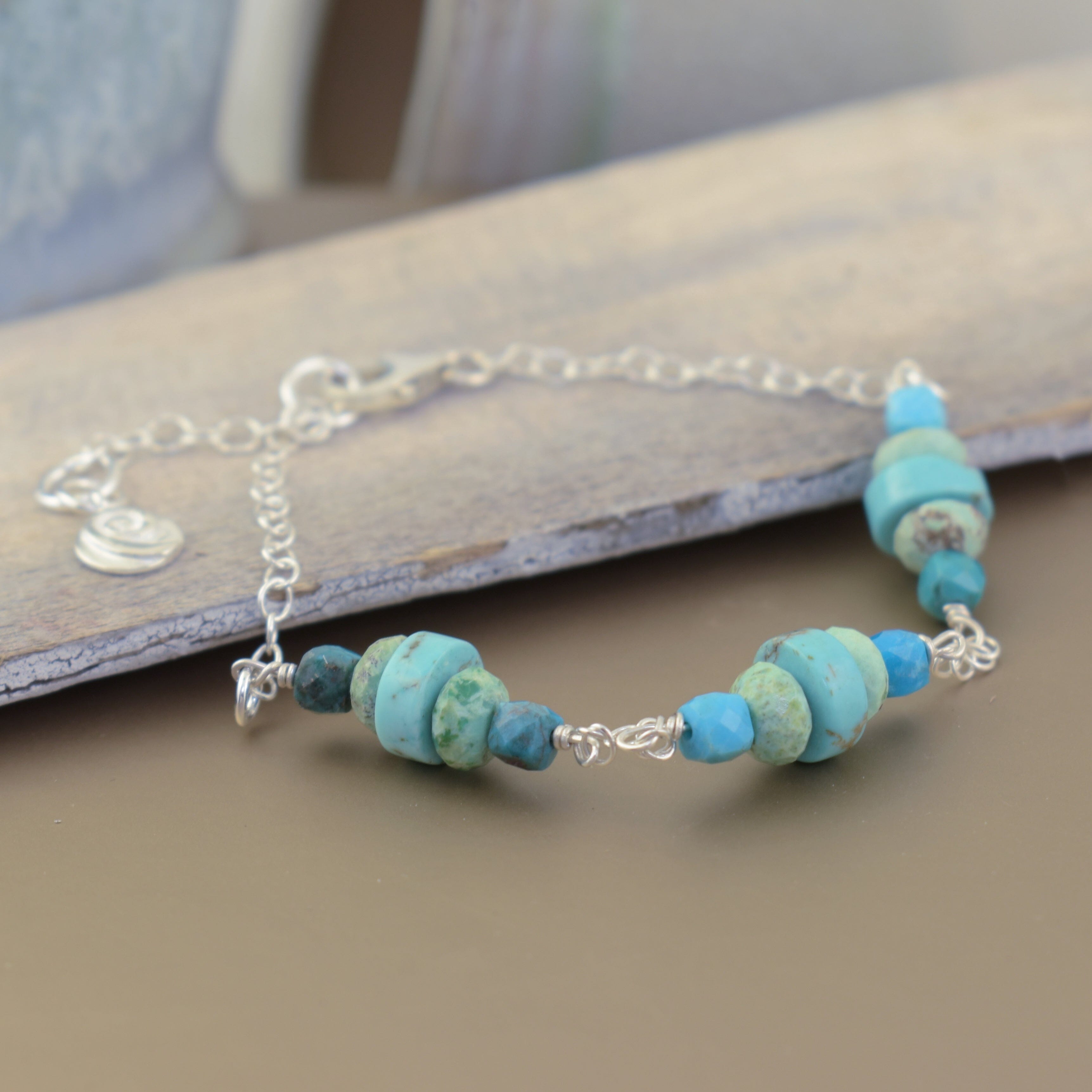 delicate sterling silver link bracelet featuring three sets of stacked turquoise strung together