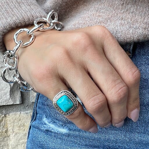 pinky ring featuring rectangular turquoise stone bezel set in a silver lasso style frame