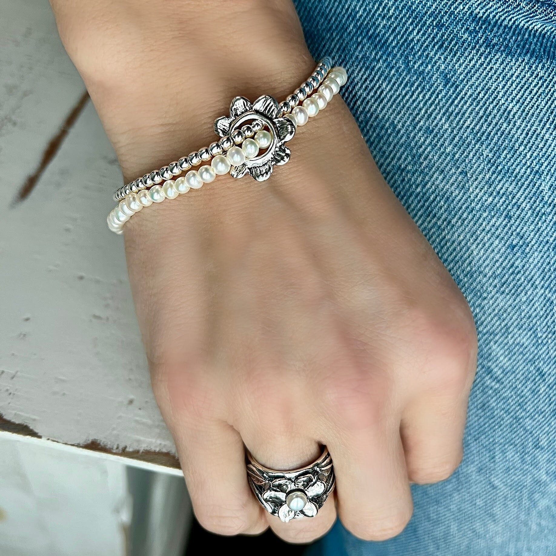 sterling silver double strand silver bead and pearl bracelet with a flower