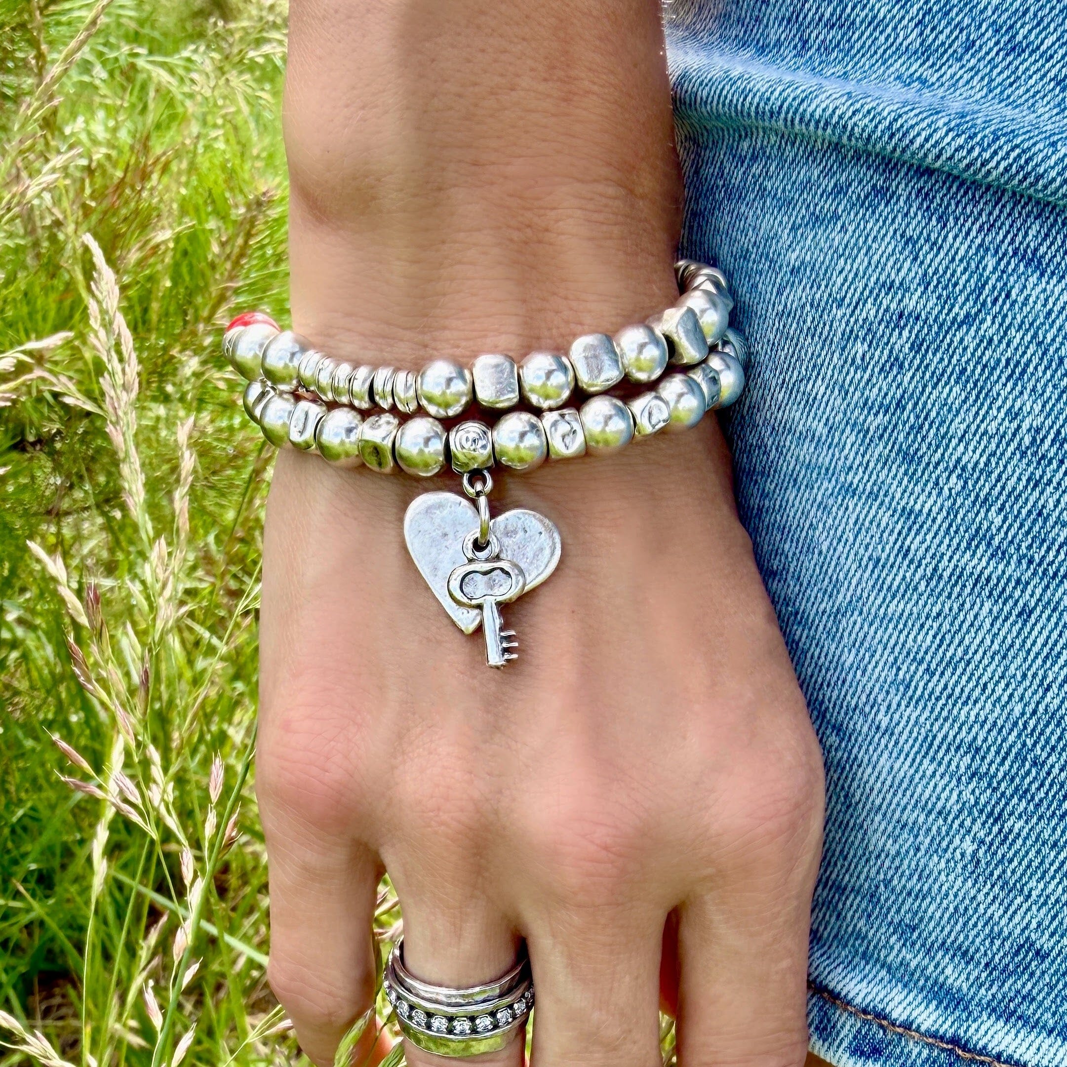 beaded doubled strand bracelet with a button closure