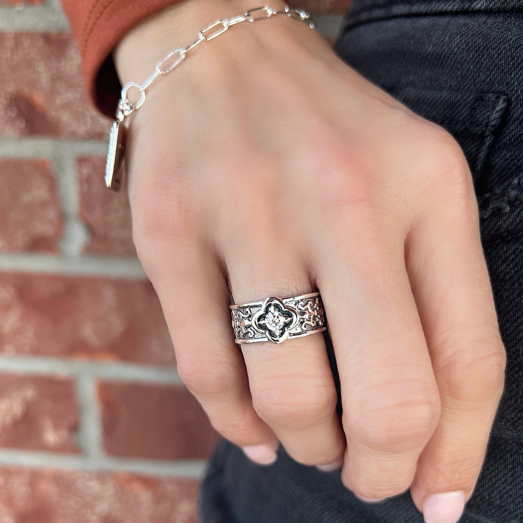 sterling silver wide band antique ring with a cz stone in the center