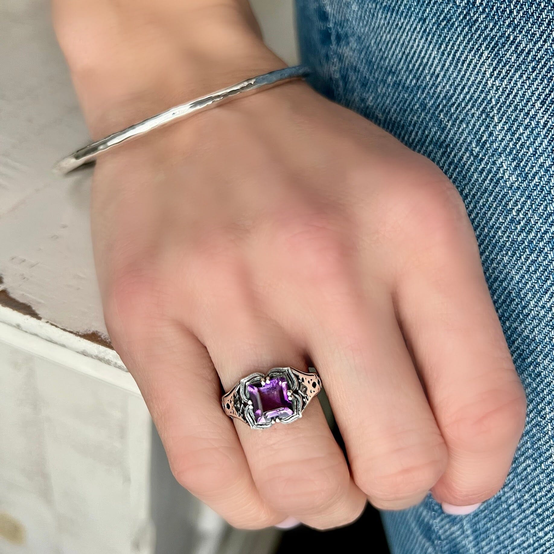 sterling silver ring with a detailed bands and a Amethyst stone