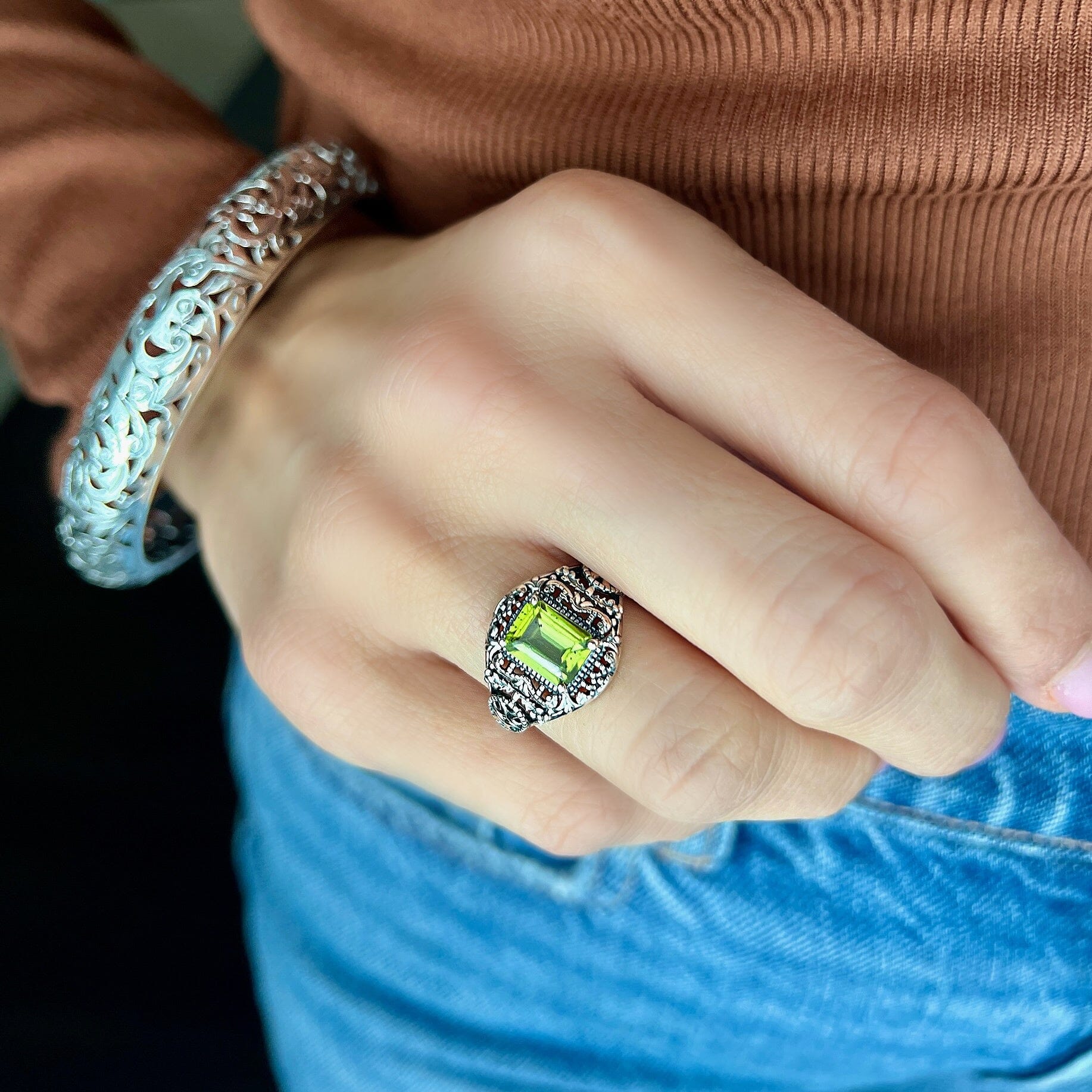 antique ring with green peridot stone  paired with the vineyard bangle