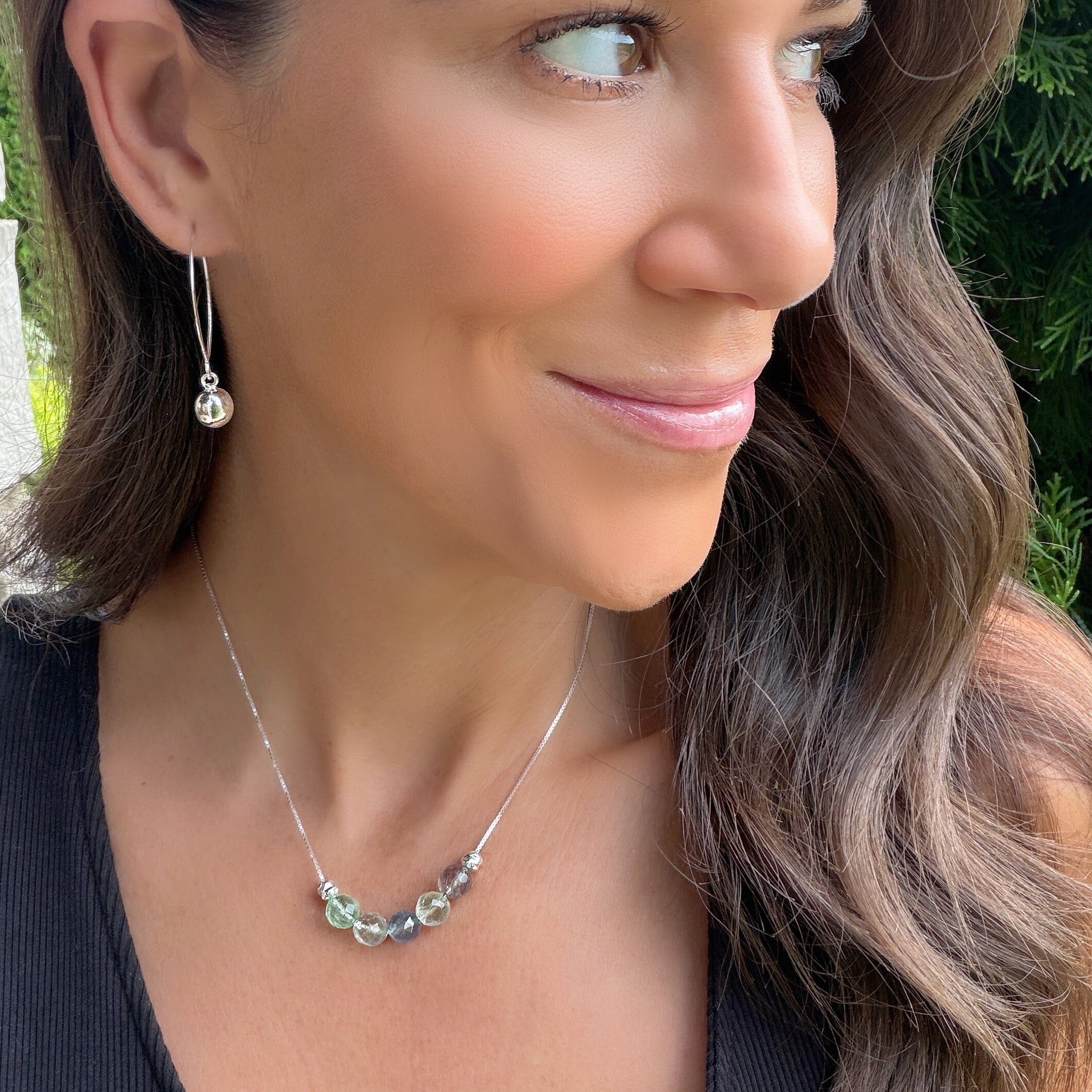 sterling silver necklace featuring faceted gemstones