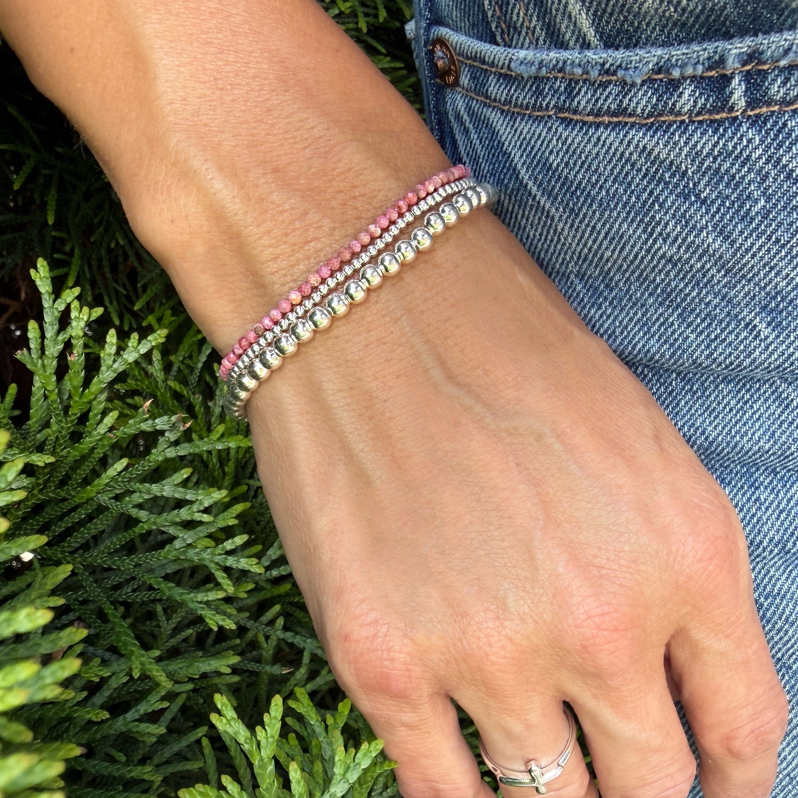 stacked bracelets in sterling silver and rhodonite