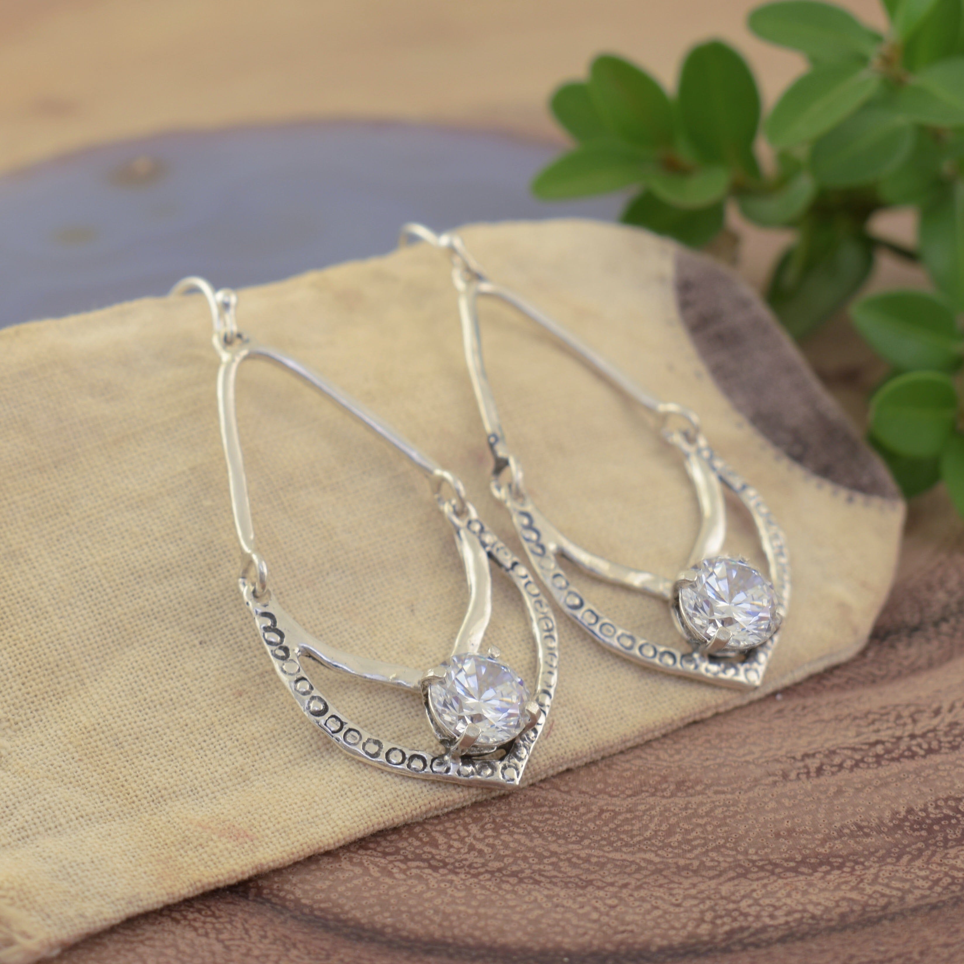 Open earrings with clear CZ stone