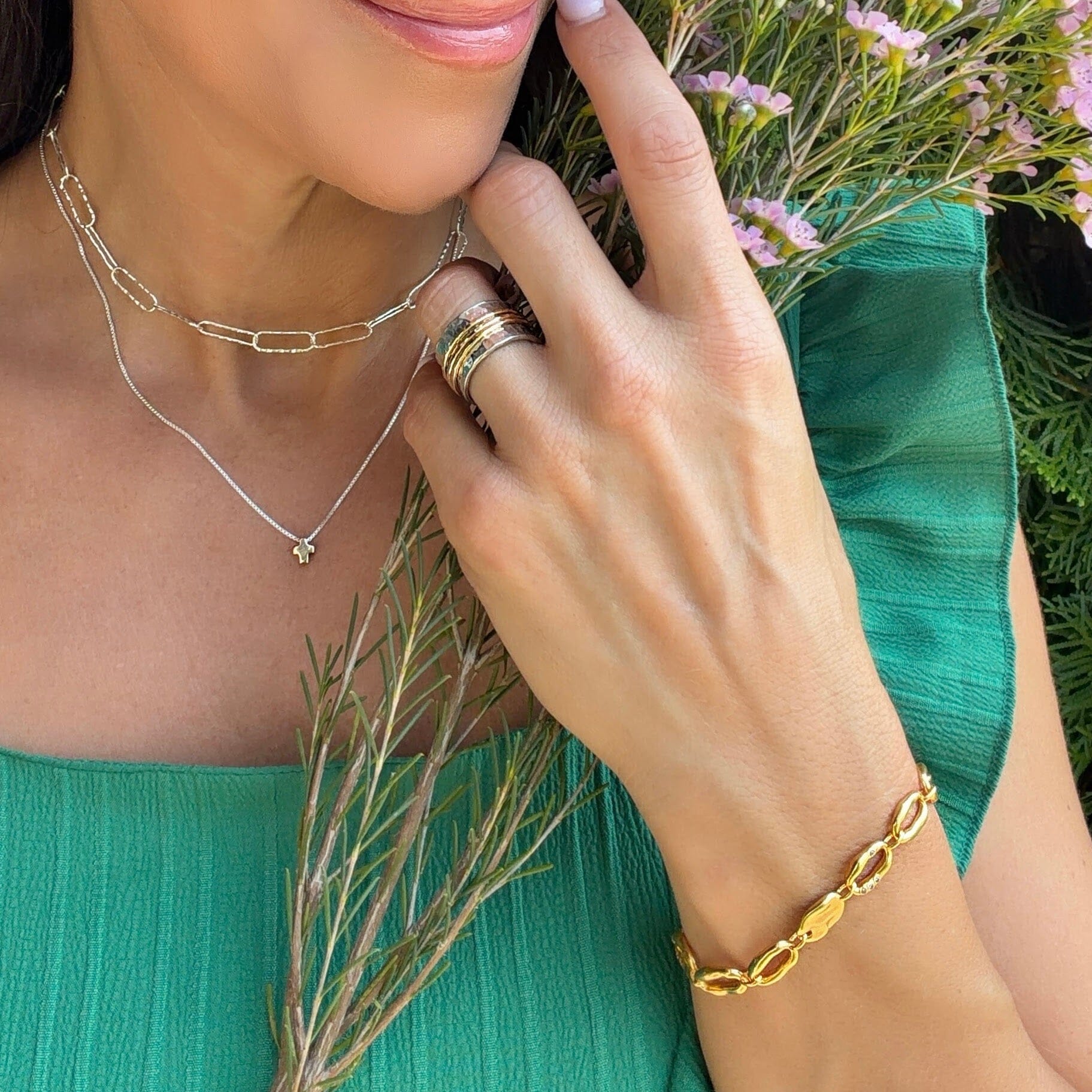 gold bracelet made of oval-shaped links with a hammered finish