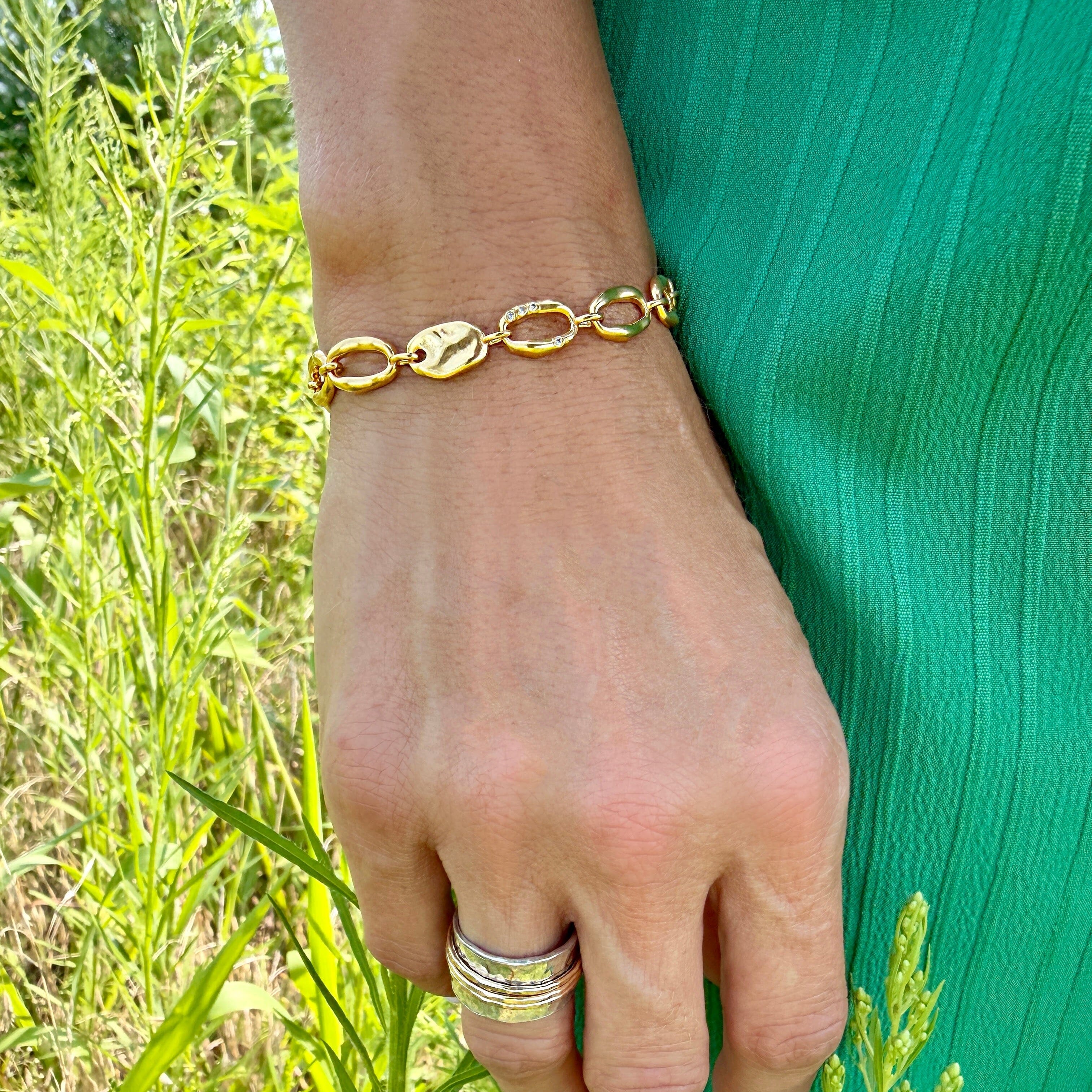 hammered oval link bracelet in gold brass