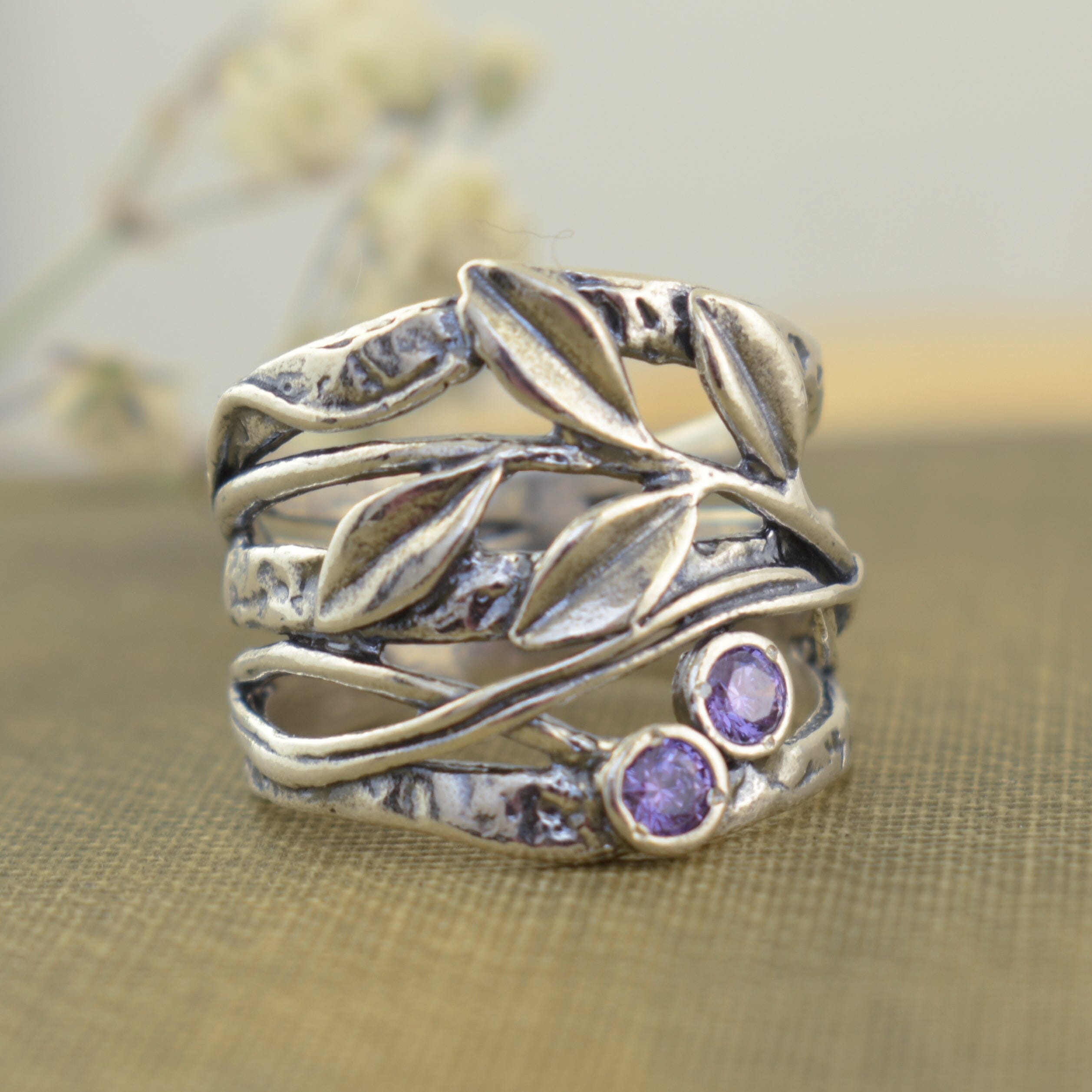 nature-inspired Wild Berry Ring featuring a leaf design and two amethyst cz stones