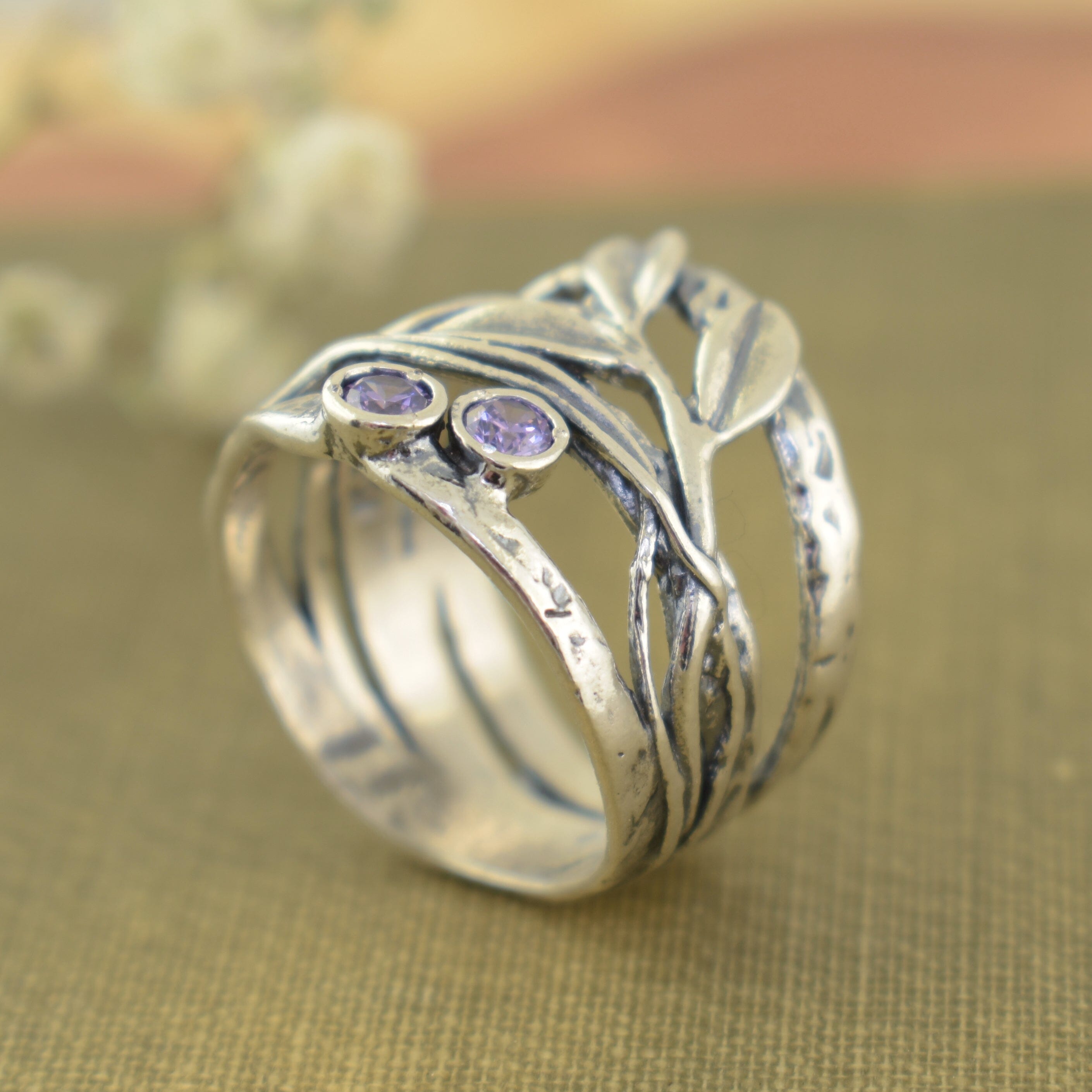 chunky designer silver ring featuring purple amethyst stones