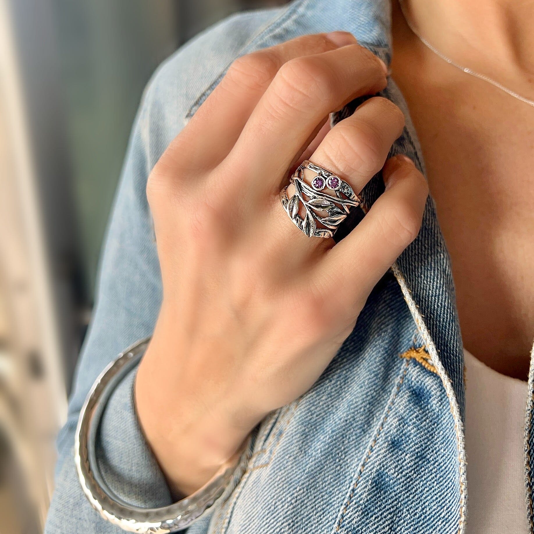 .925 silver hand crafted ring featuring a vine detail and Amythest stones paired with the hammered bliss bangle