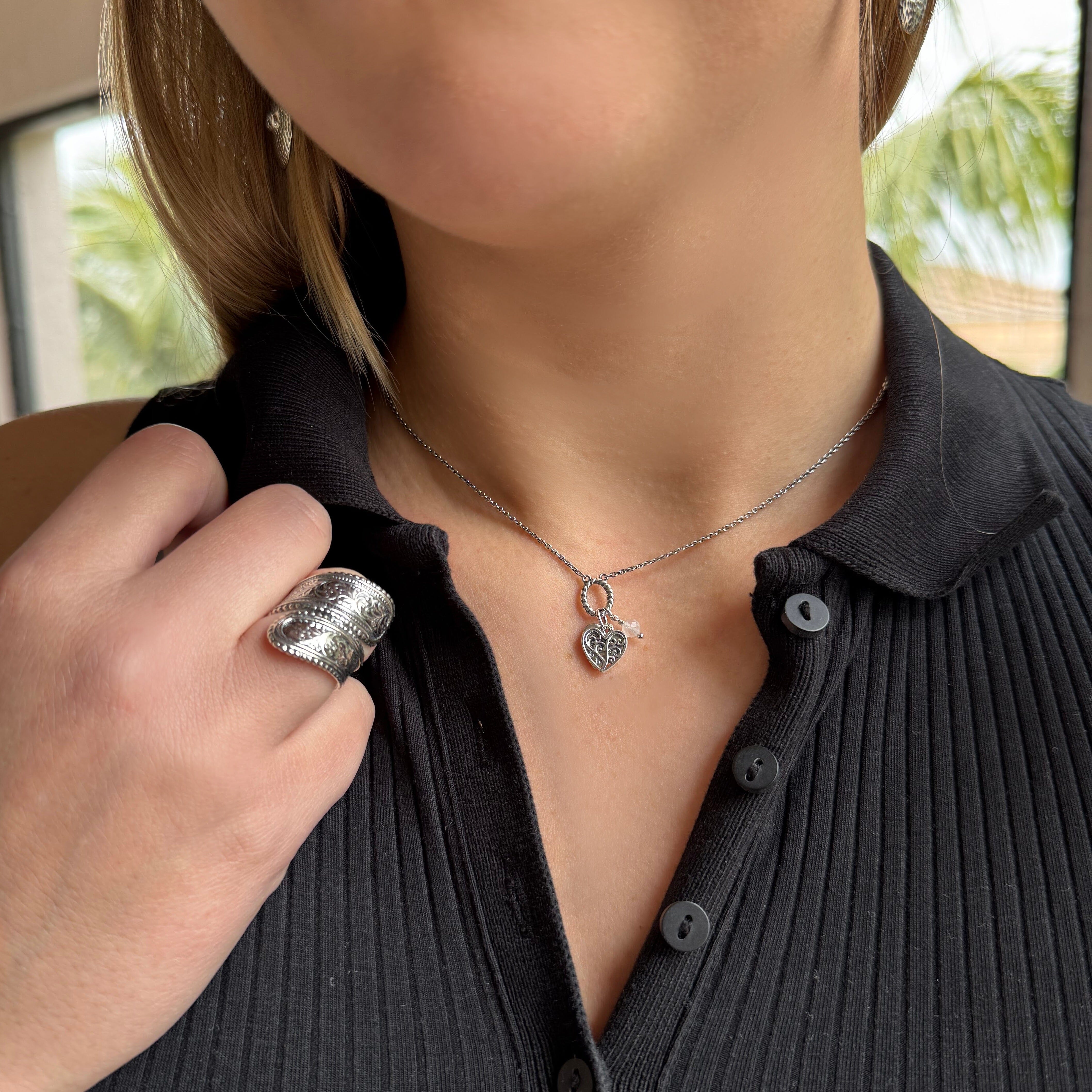 handcrafted silver featuring a filigree  heart and a heart hand stamped paired with the swoon ring