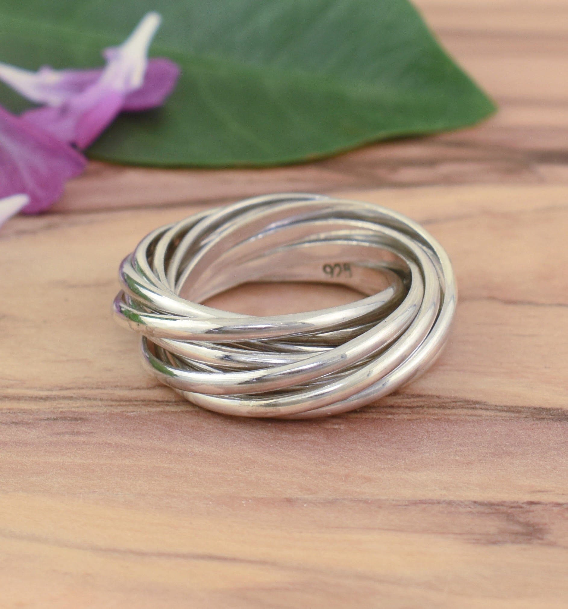 Designer sterling silver Amuse Me Ring featuring 10 interlocking bands