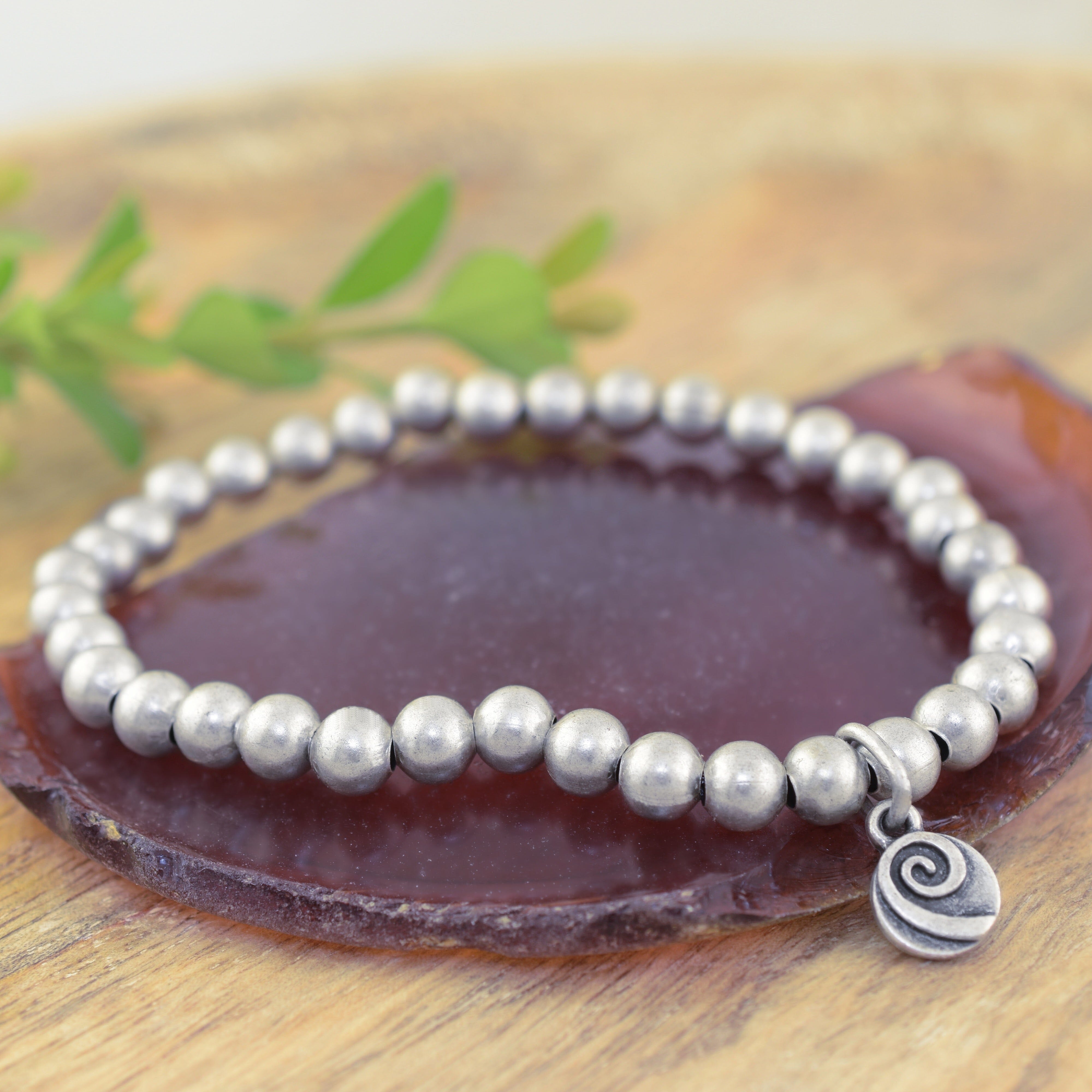 A silver beaded stretch bracelet