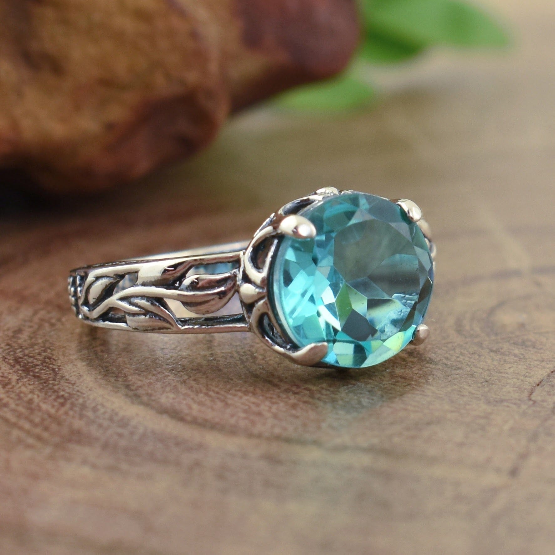 Sterling silver ring with round blue-green gemstone