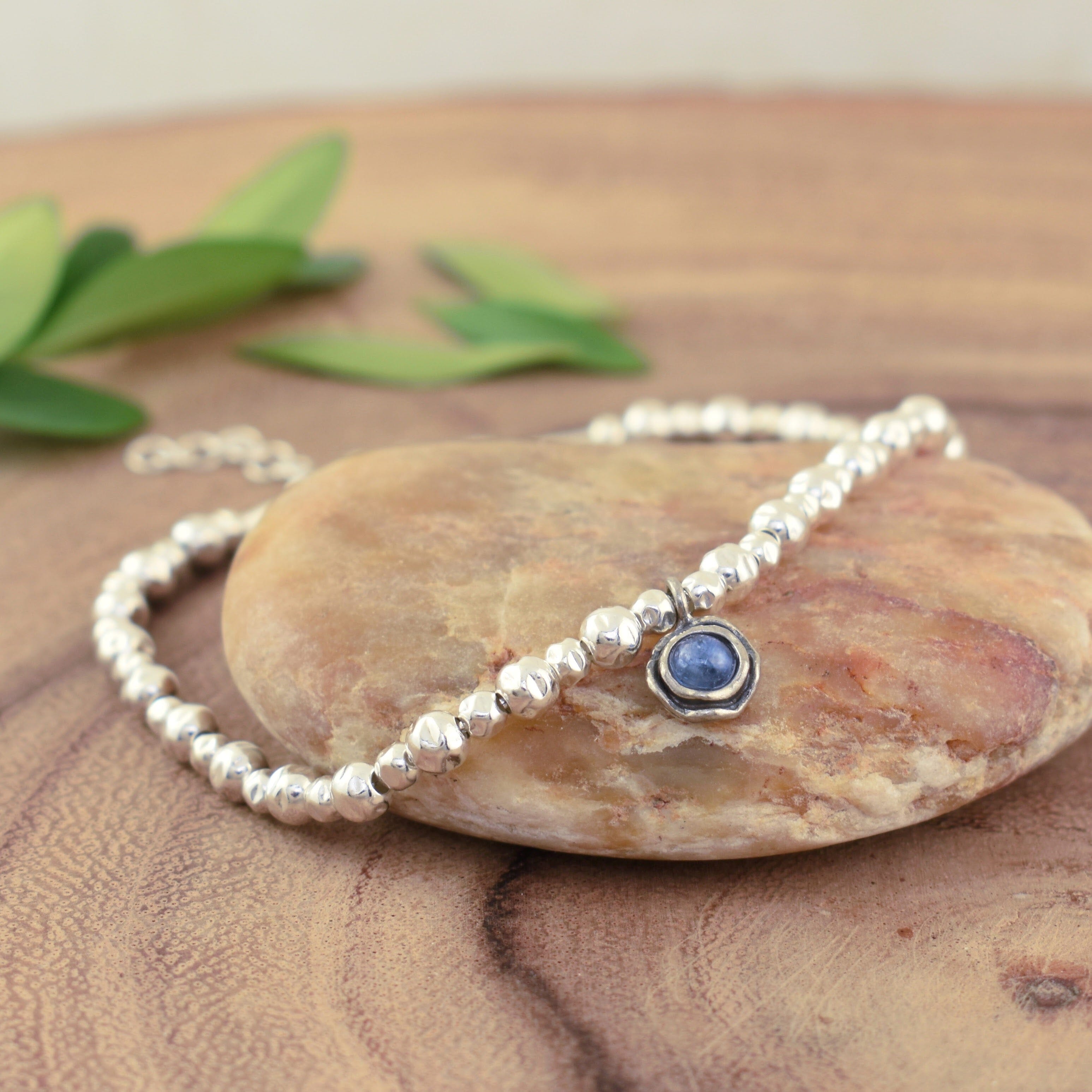 Blue Jean Bracelet featuring high polished sterling silver beads and a single blue kyanite stone