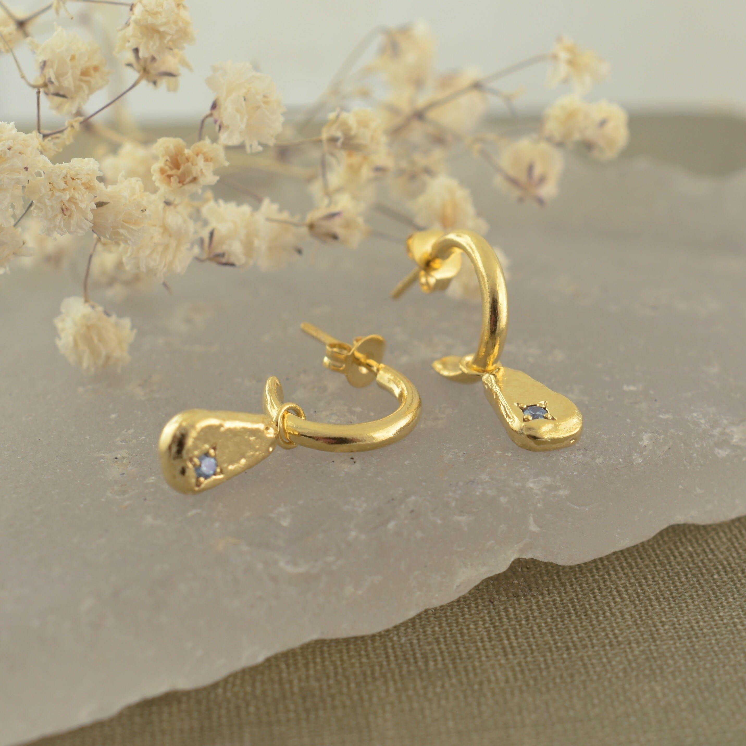gold hoop earrings with a hammered dangle