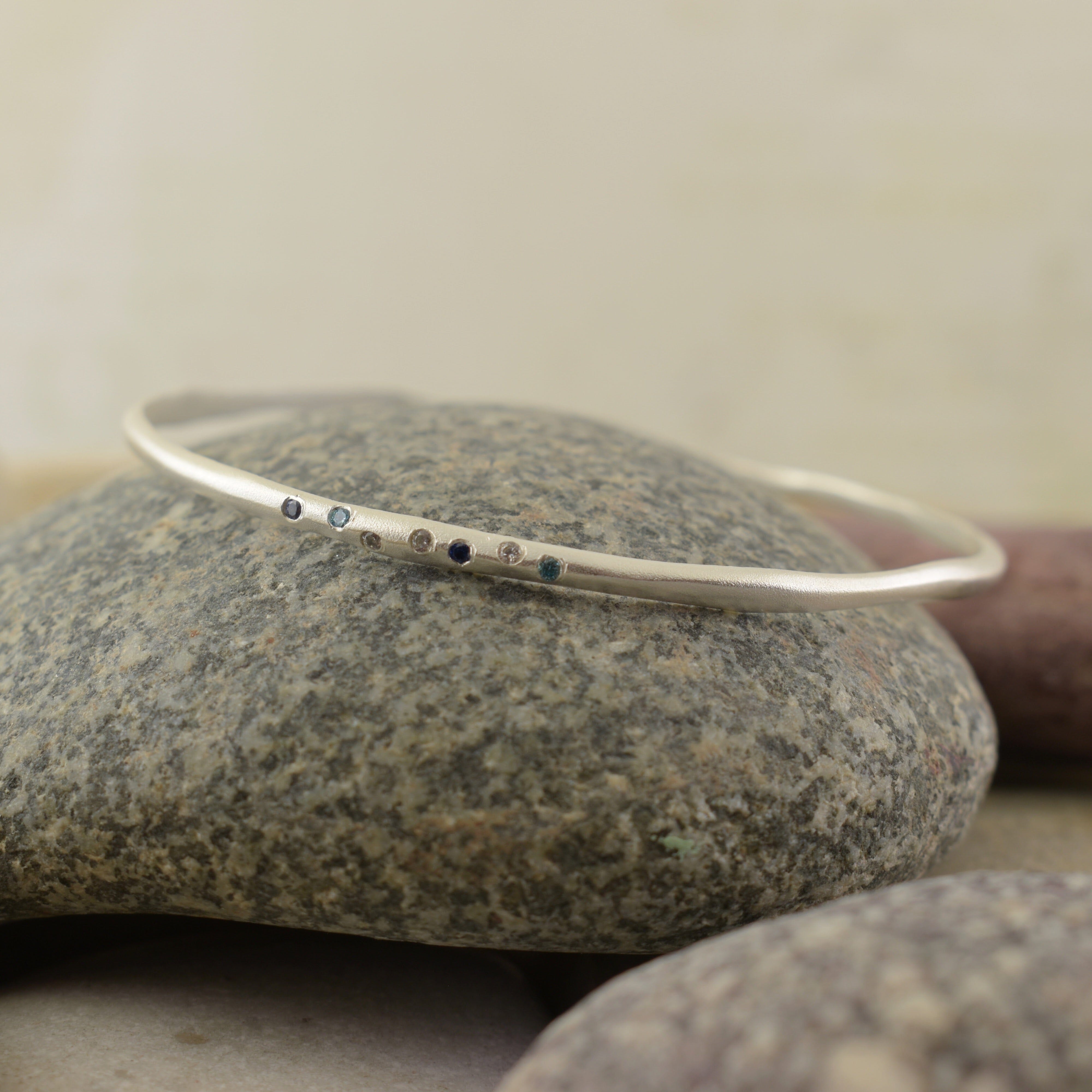 silver and blue cz zamak bangle