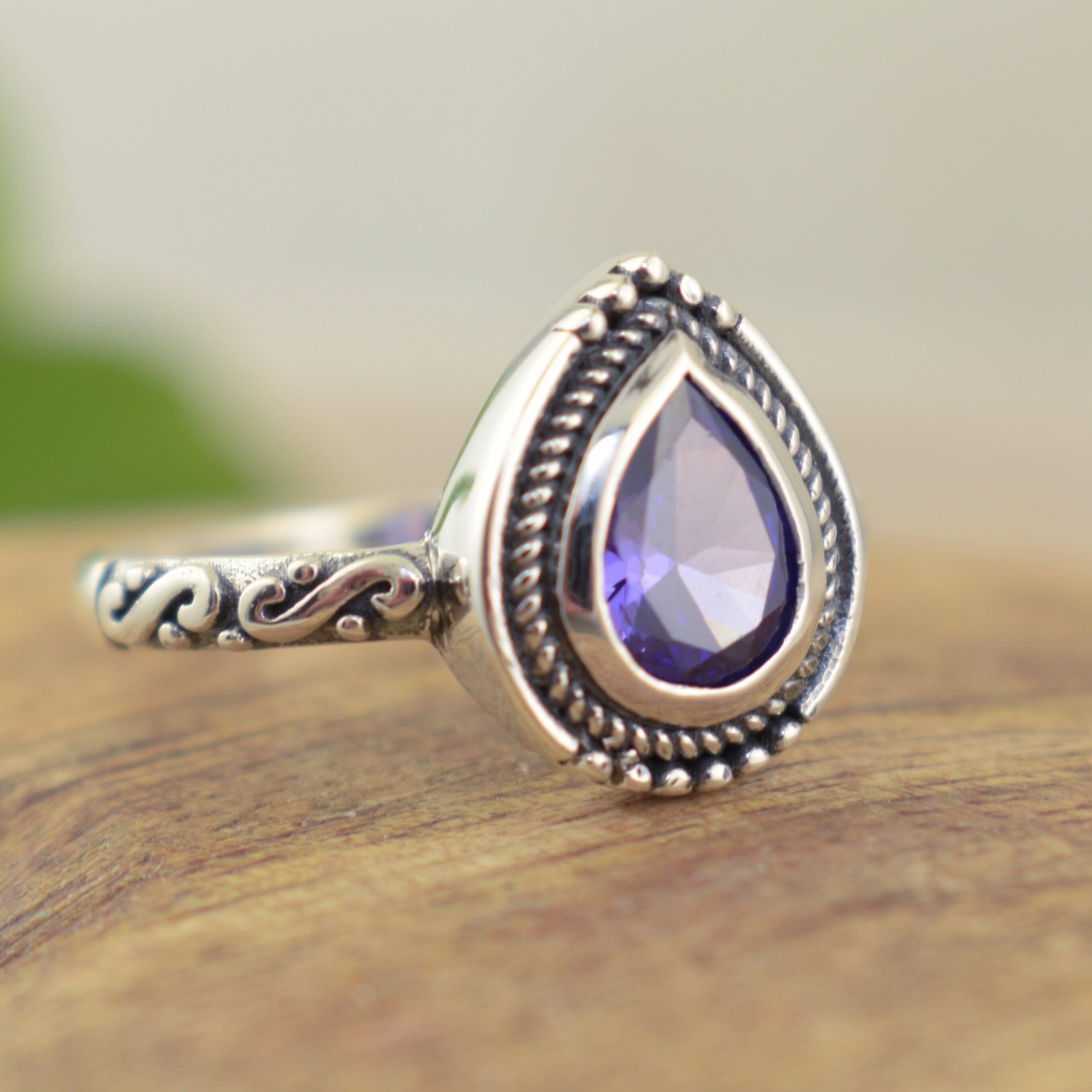 Purple teardrop ring featuring antiqued sterling silver