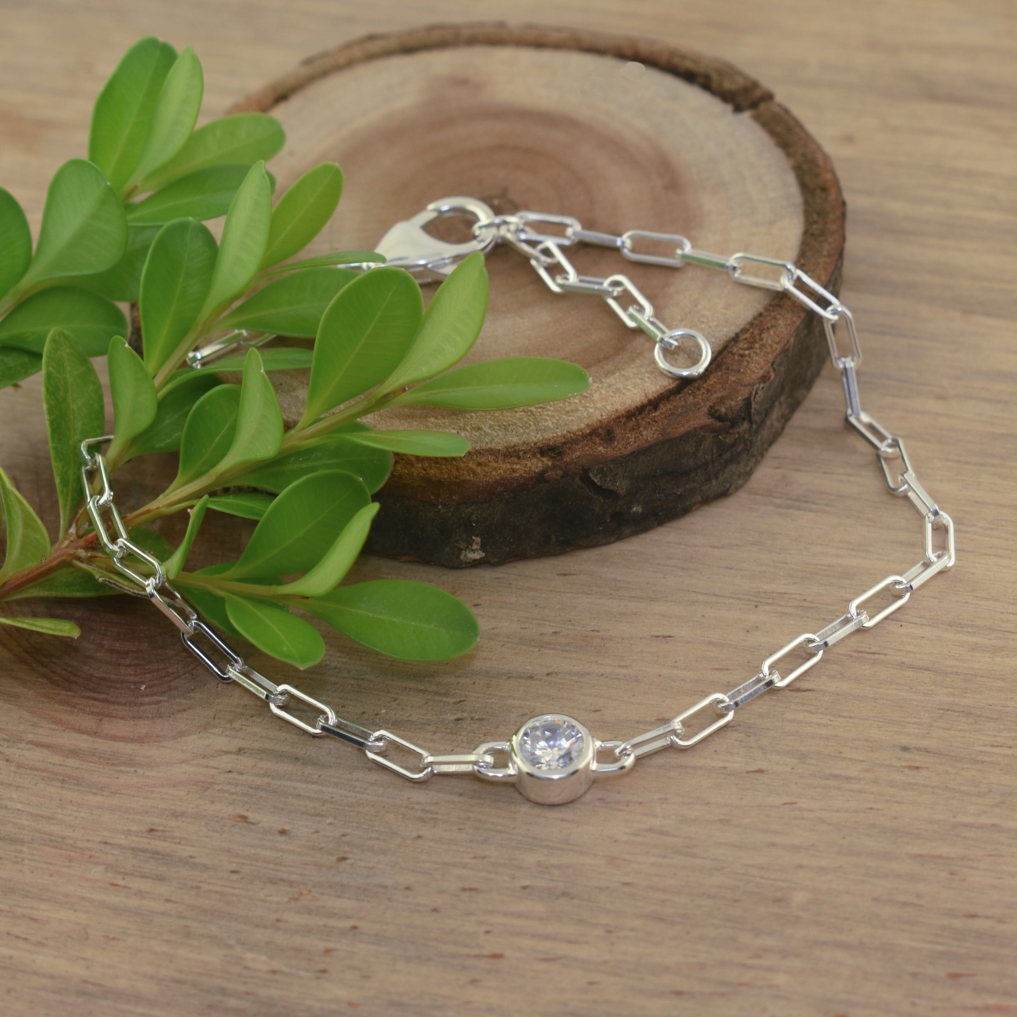 Dainty sterling silver paperclip chain bracelet with single cubic zirconia stone