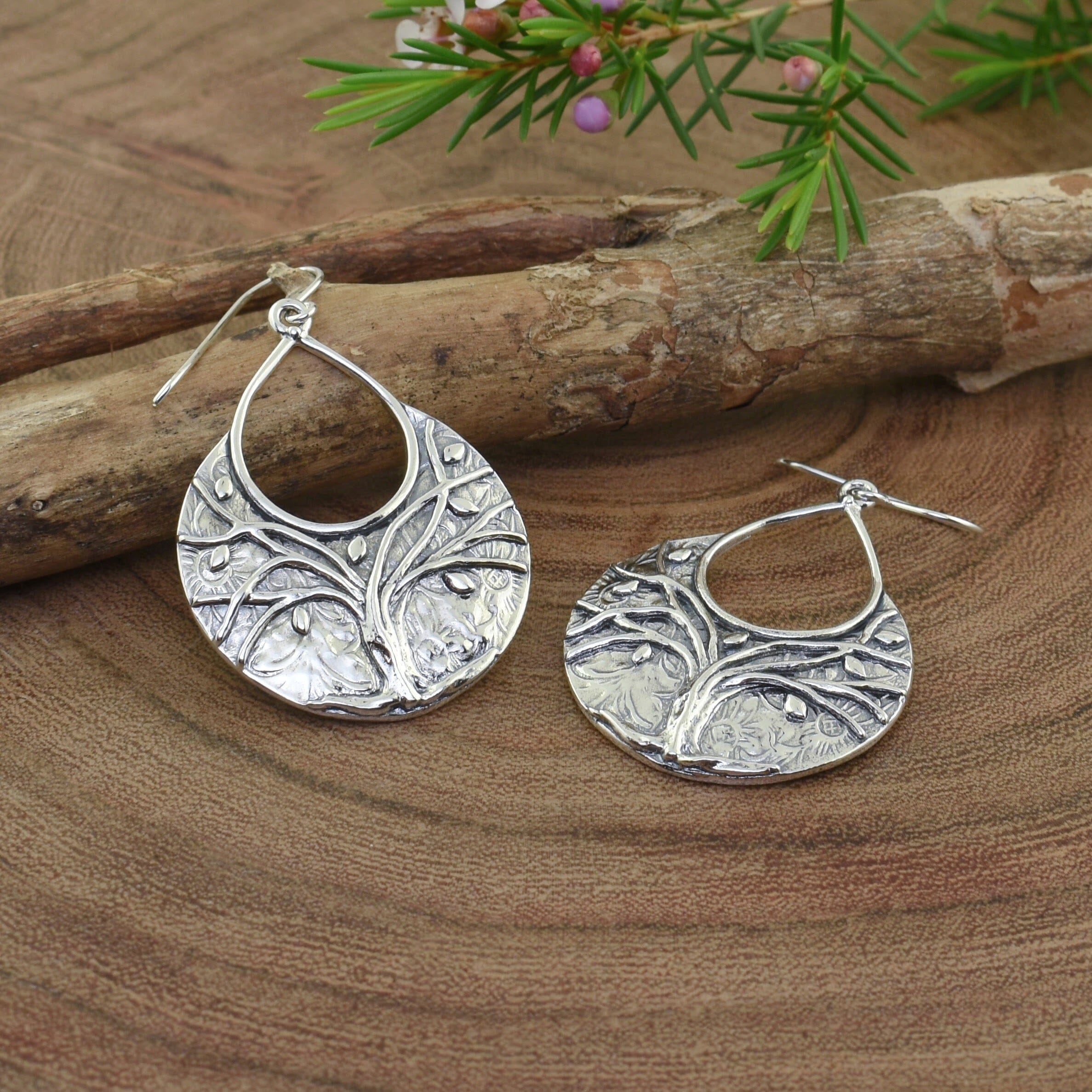 .925 sterling silver dangling earrings featuring a tree