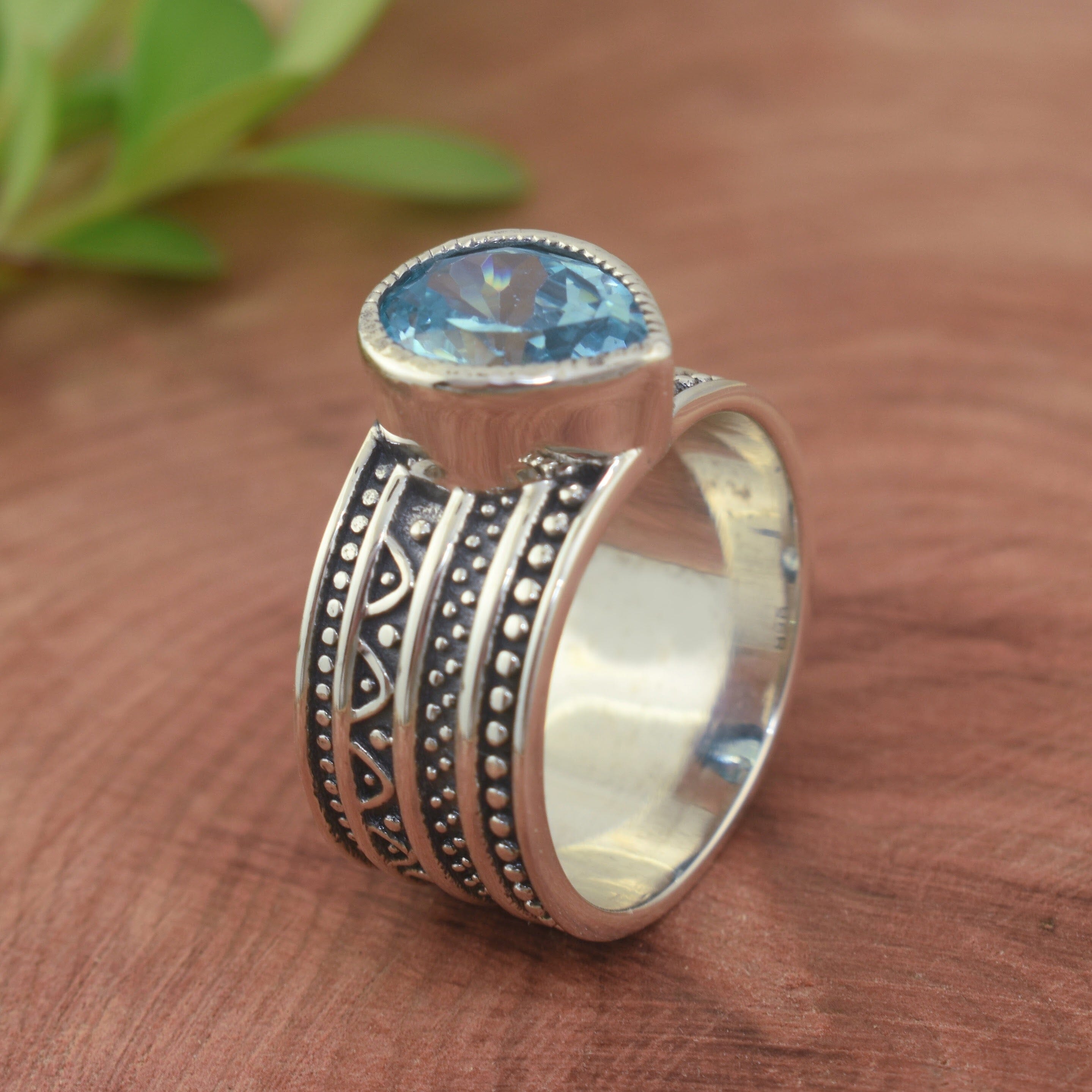 Blue teardrop shaped stone set in .925 sterling silver band