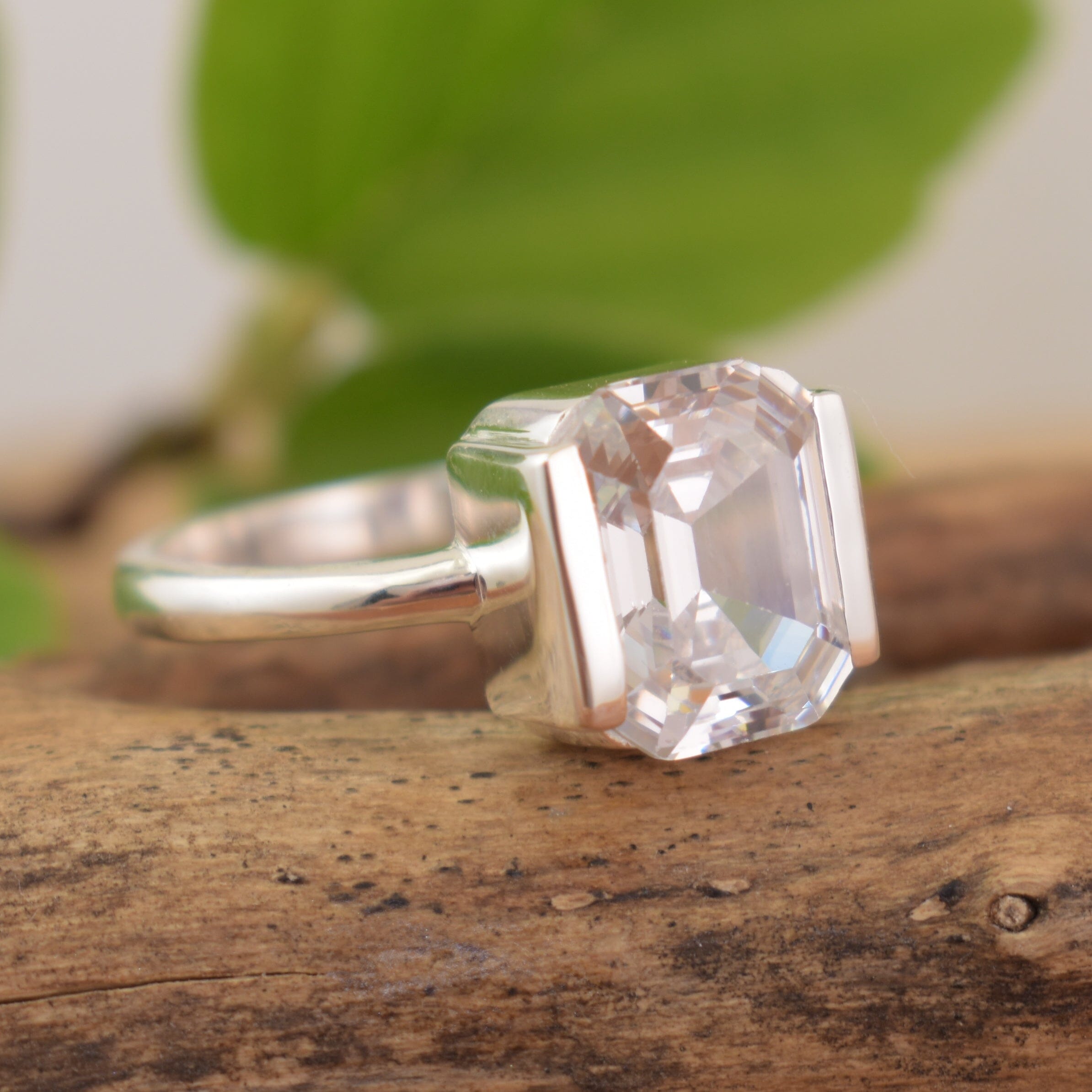 .925 high polished sterling silver ring with emerald cut stone