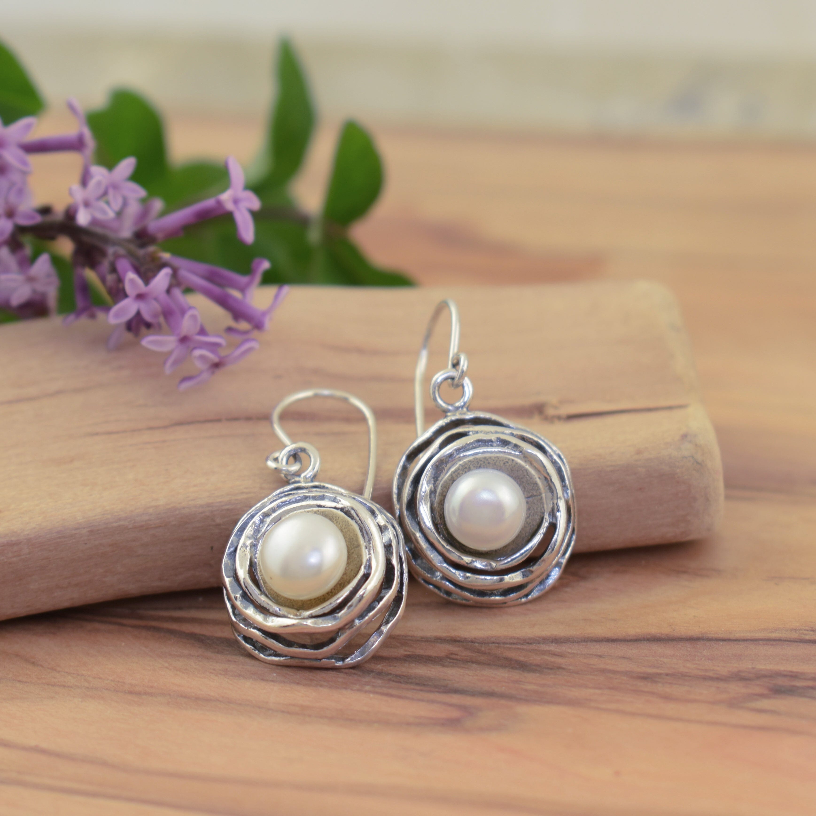 Antiqued sterling silver earrings featuring white freshwater pearls