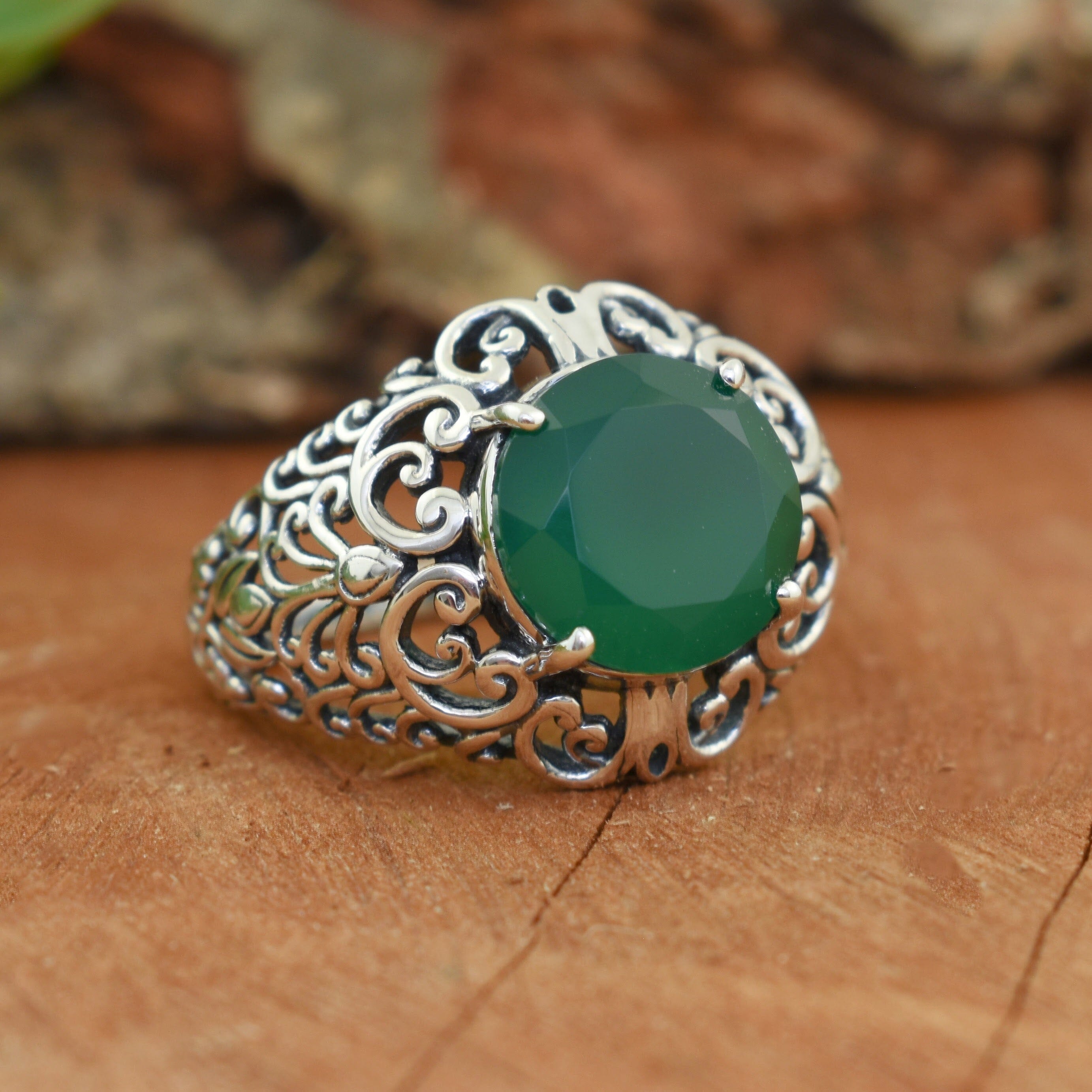 Ornate sterling silver ring with green stone