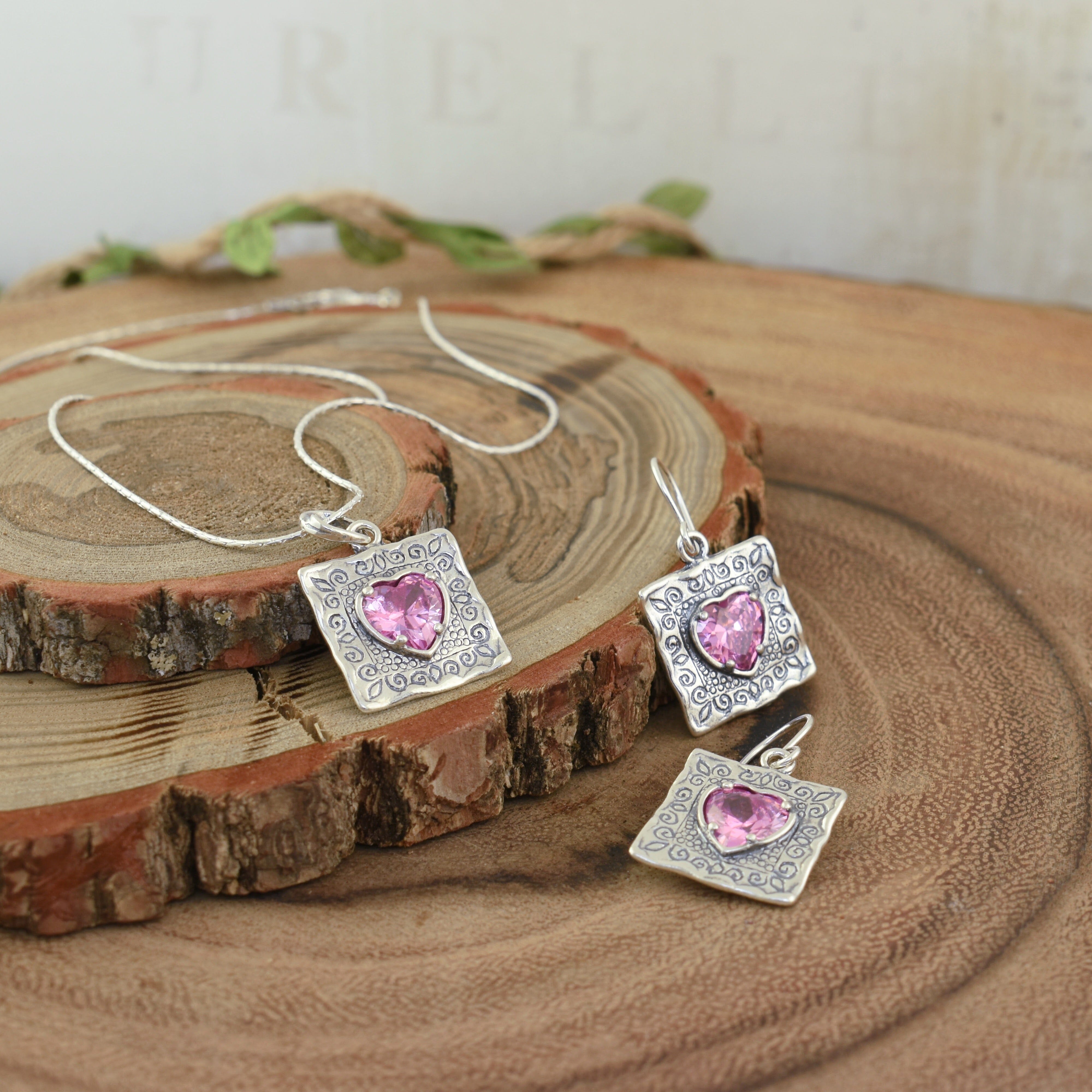 Matching sterling silver and pink heart necklace and earrings