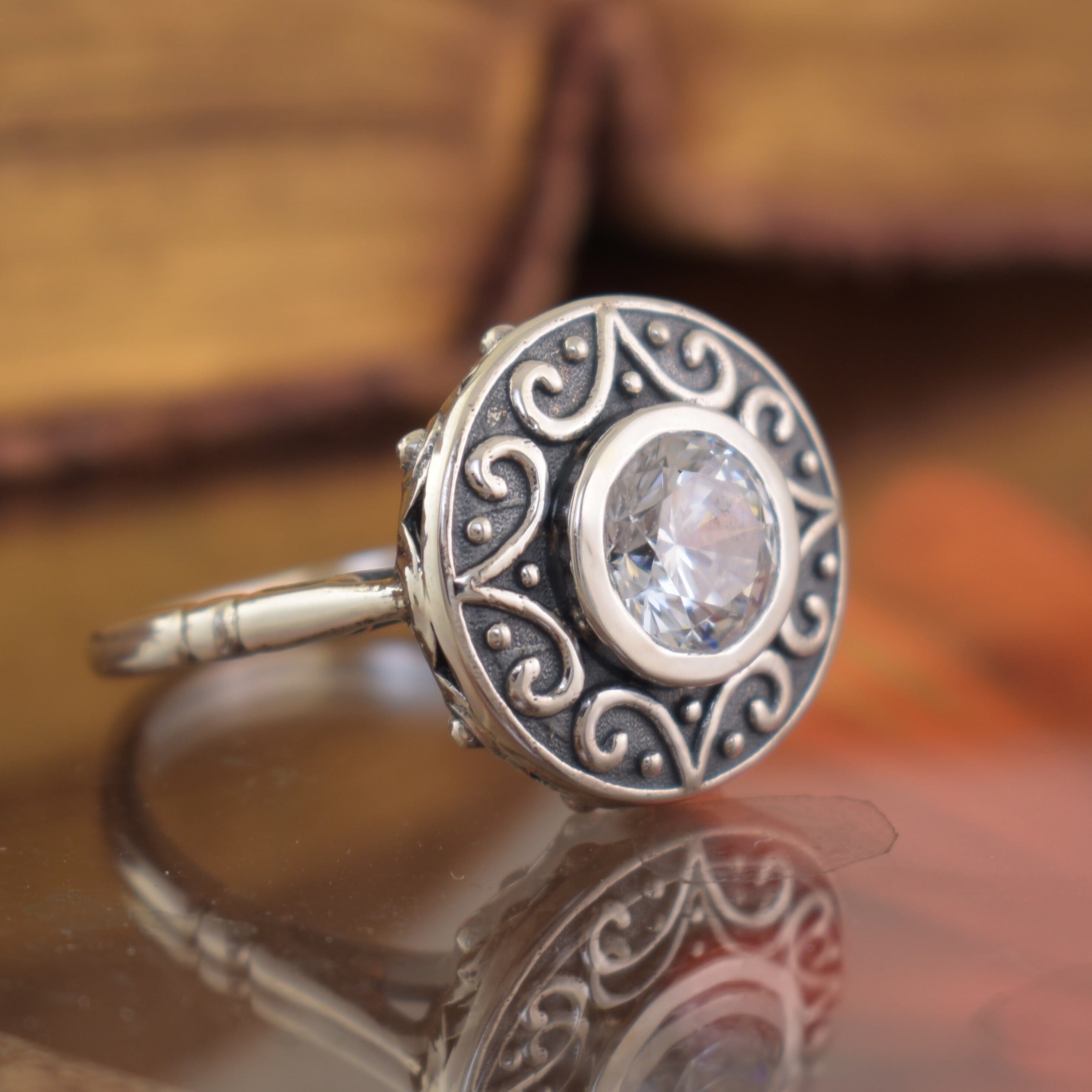 Circular sterling silver ring with round CZ stone