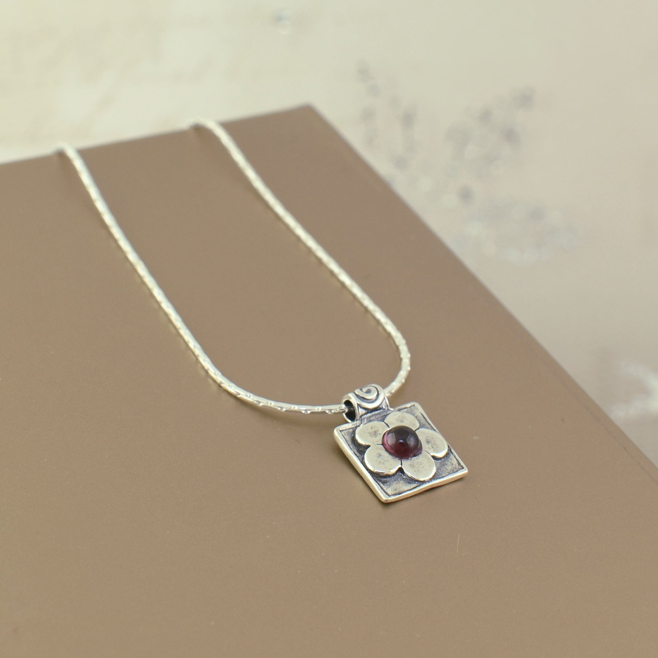 garnet flower necklace set in .925 sterling silver