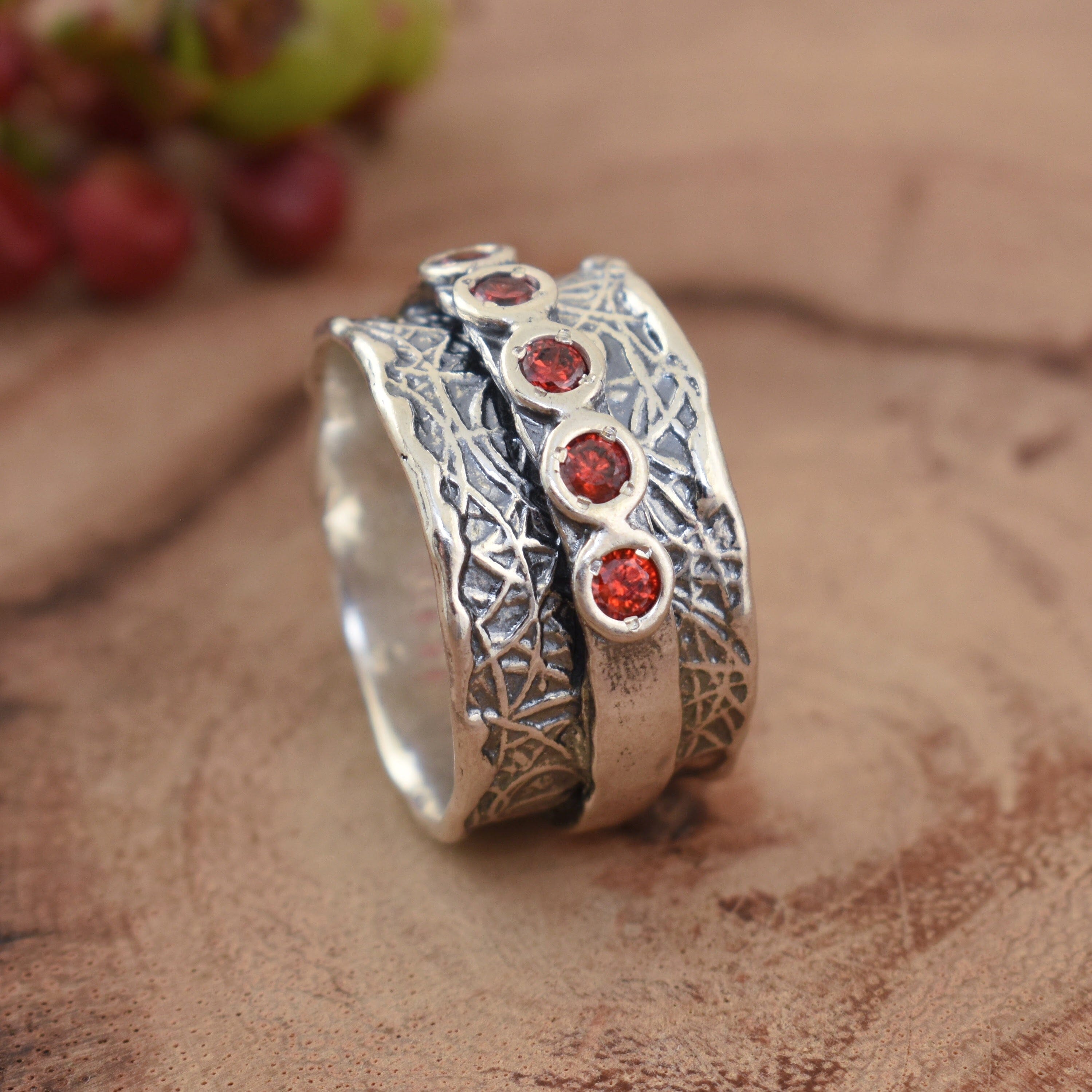 Sterling silver ring with red stone accents