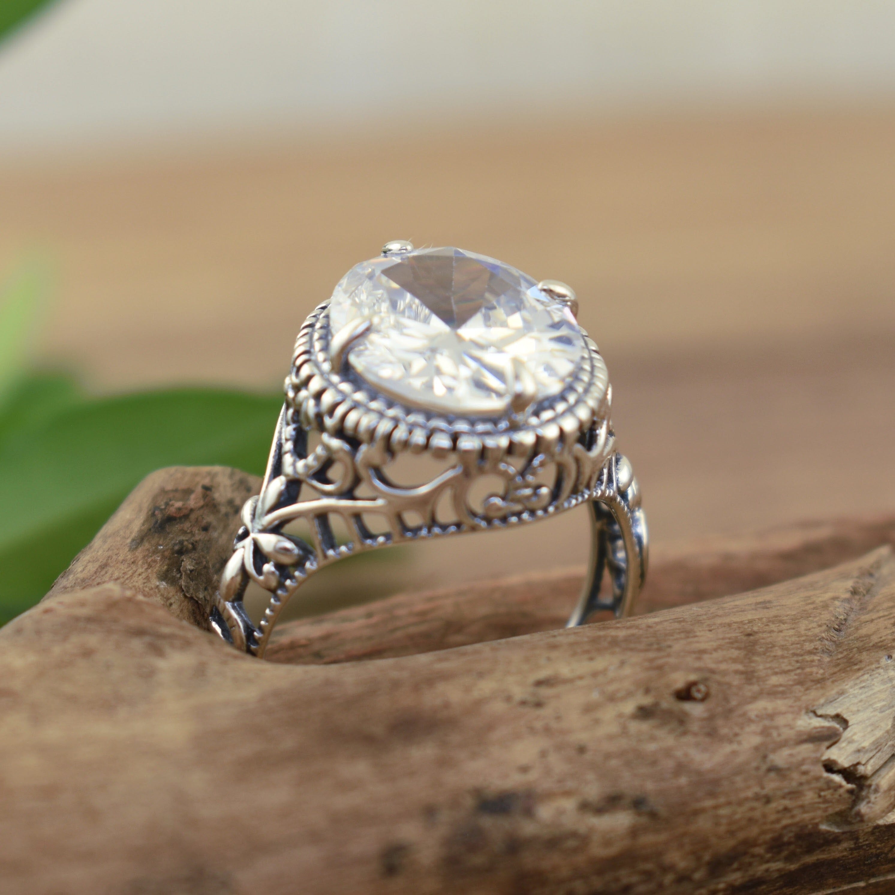 designer silver heirloom style ring featuring oval cubic zirconia