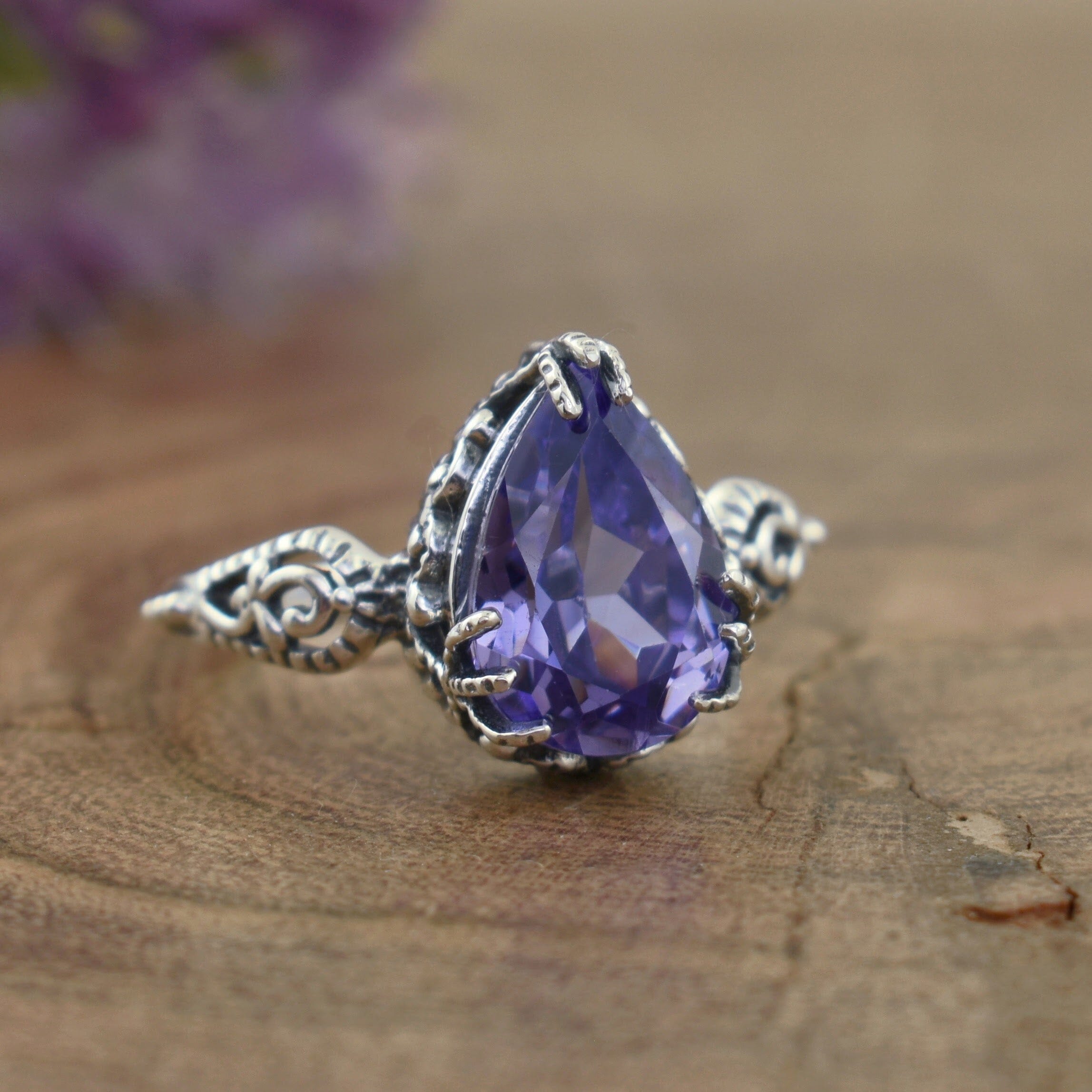 Pear-shaped purple stone ring set in .925 sterling silver
