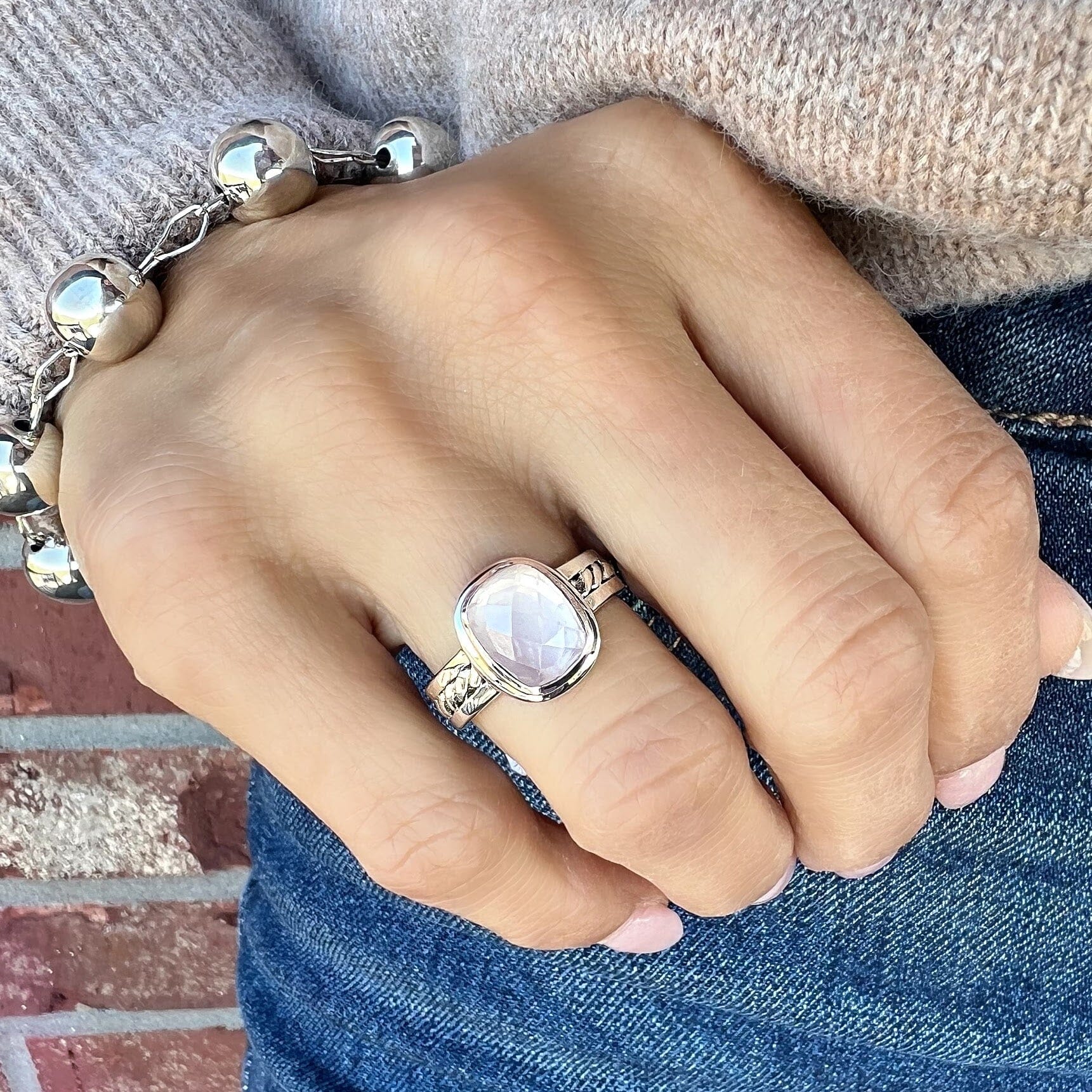 sterling silver designer ring with a rectangular rose quartz center