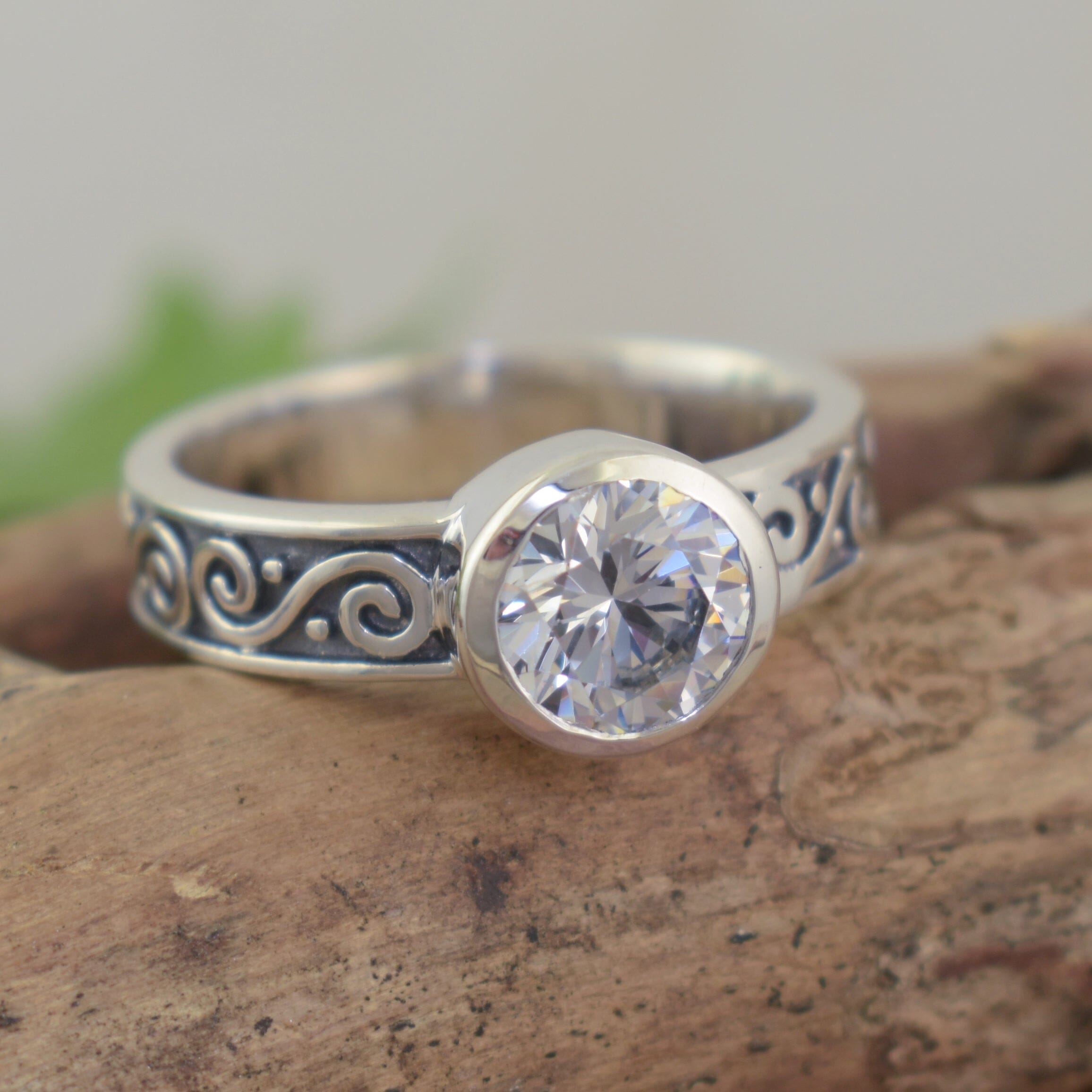 High polished/antiqued sterling silver swirl ring with round cubic zirconia stone