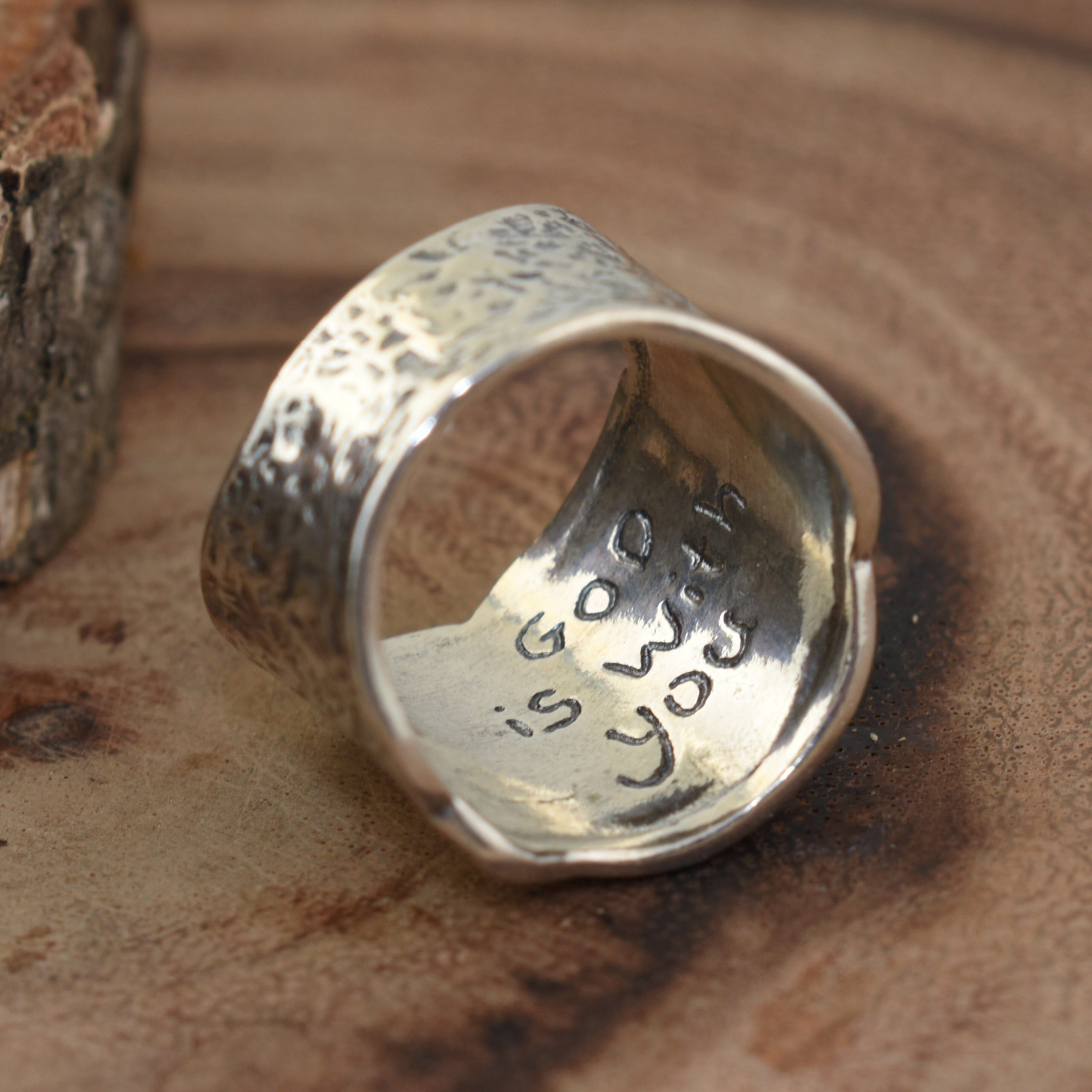 Ring inscribed with "God is with you"